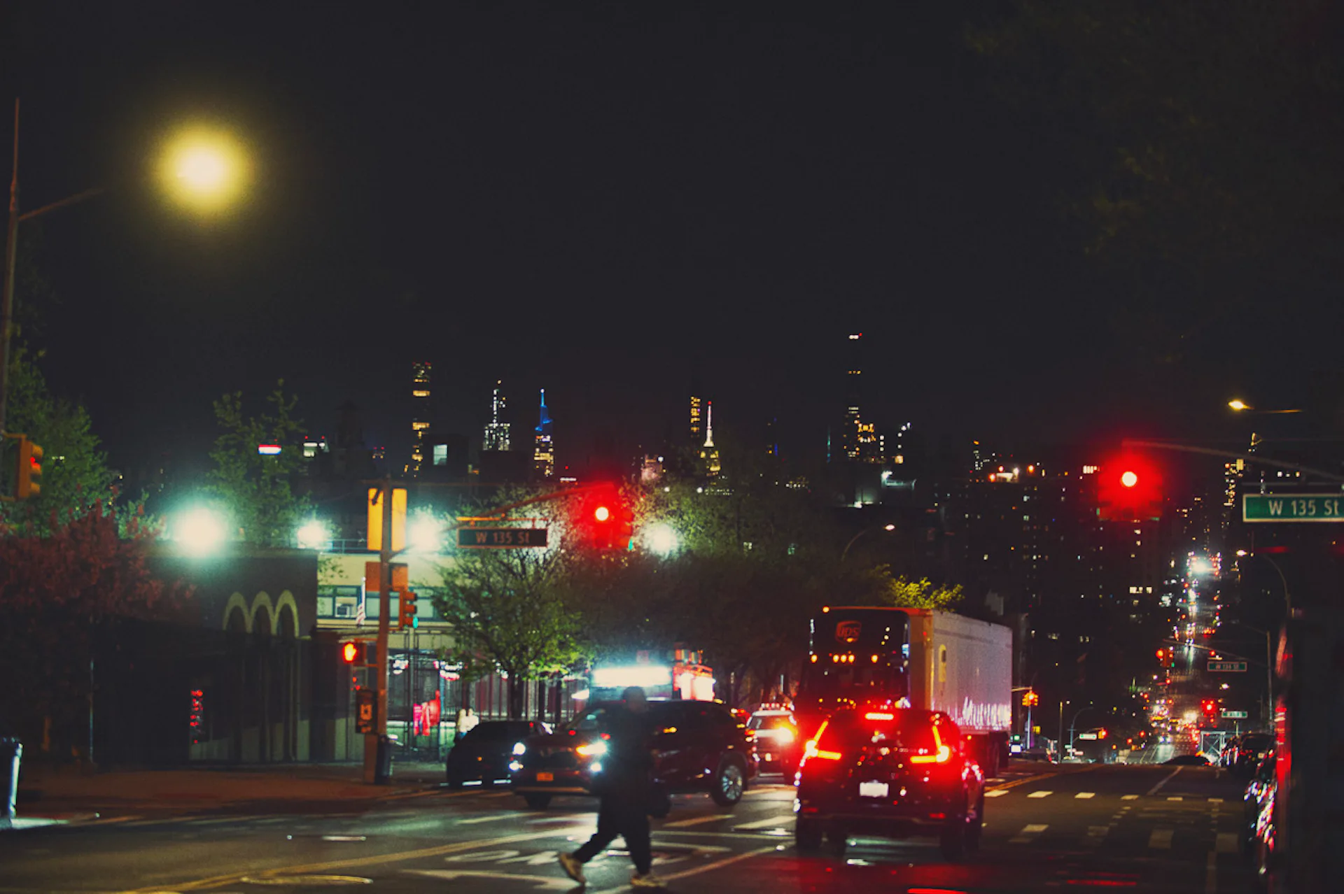 NYC streets facing downtown at nighttime