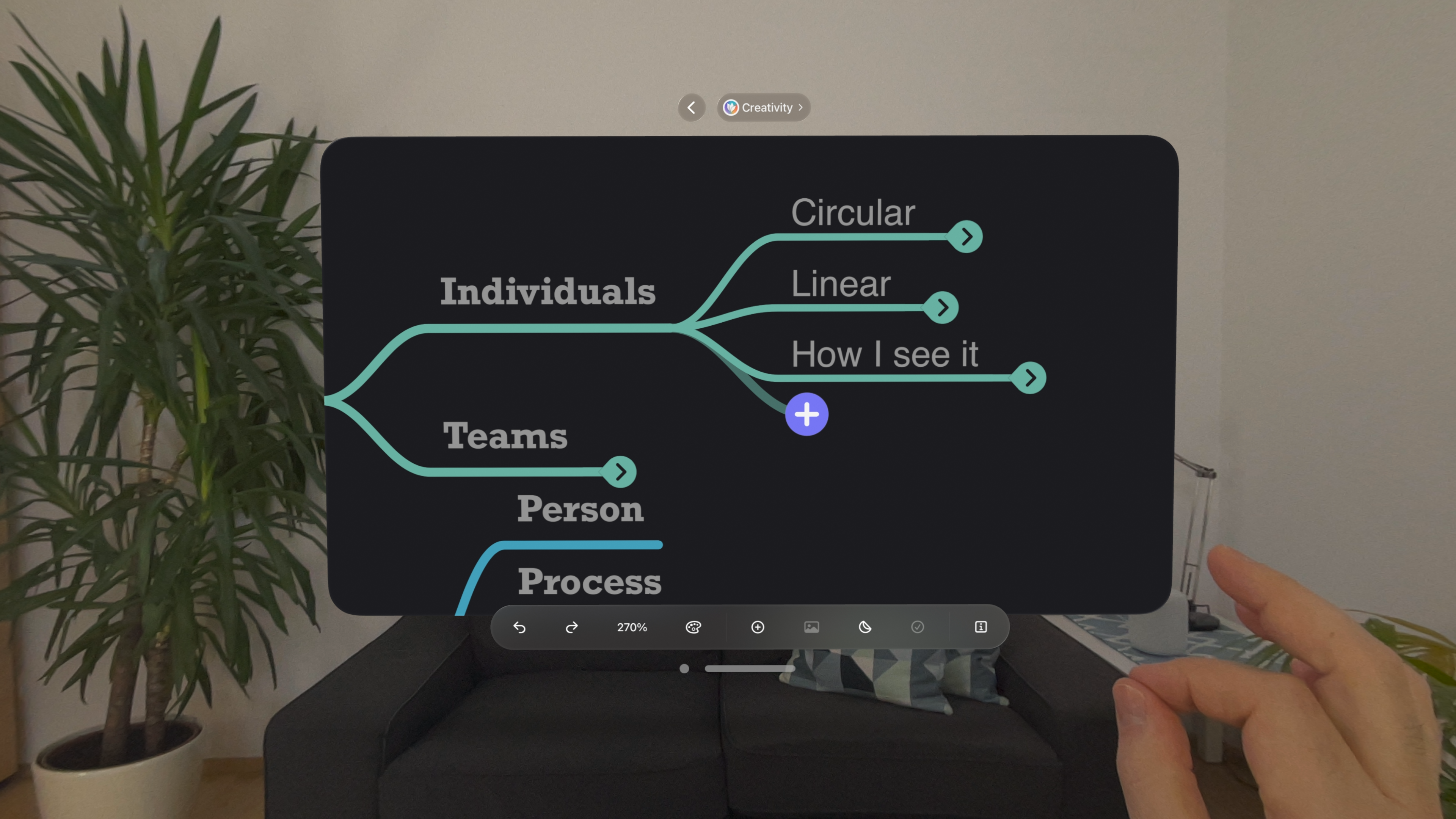 Dragging a plus sign with the hand in MindNode Next for Apple Vision Pro