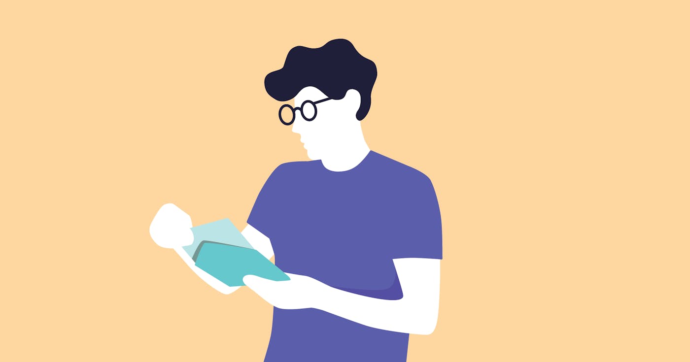 Person with glasses, reading a letter.