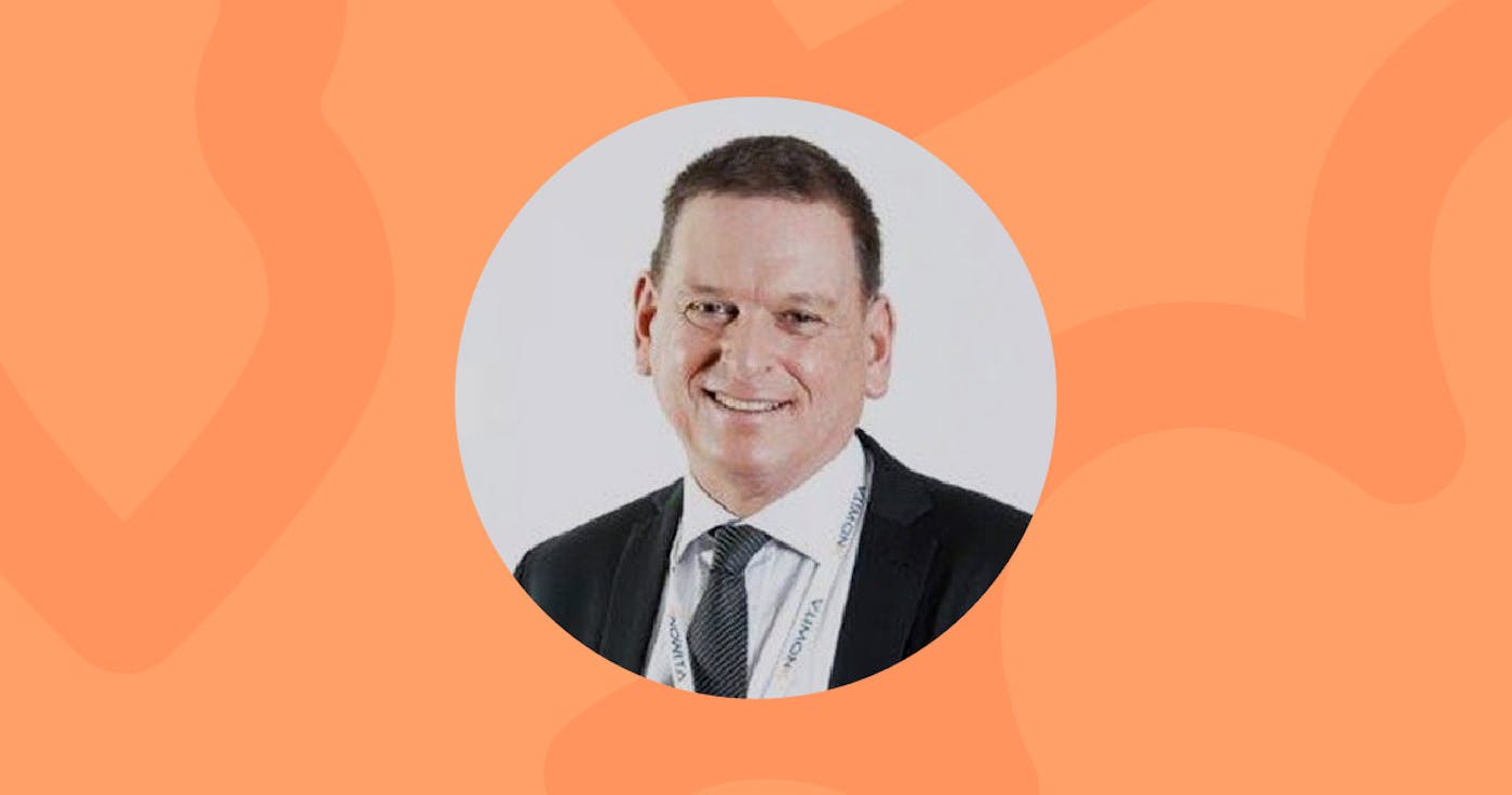 Round portrait of Phil Taylor in the middle on orange background.