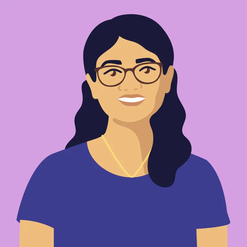 Digital illustration. Headshot of Deepa Antony, a person with a medium skin tone and dark wavy shoulder-length hair, wearing dark framed glasses, a gold necklace, and a short-sleeved blue shirt.