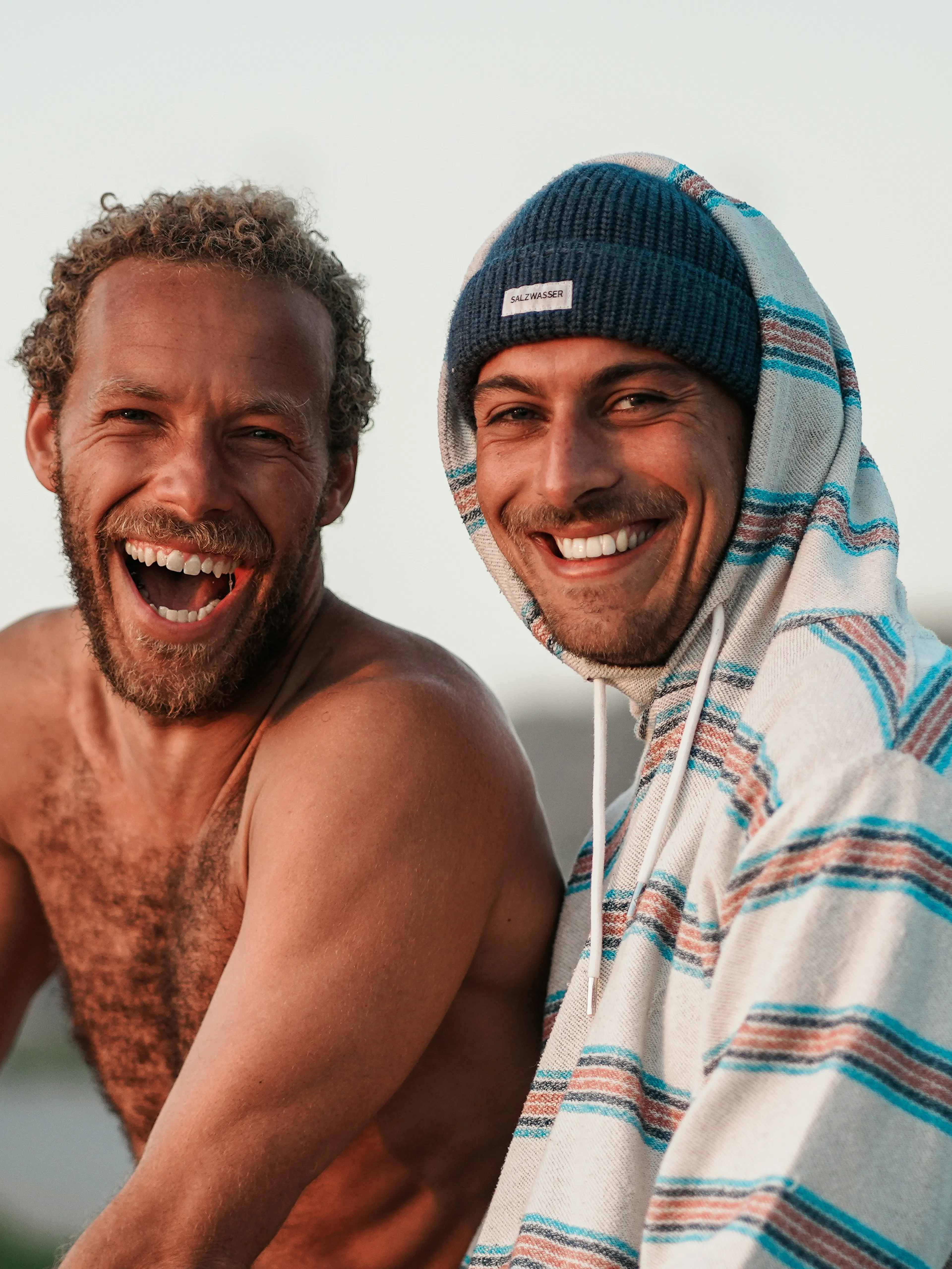 a couple of men standing next to each other