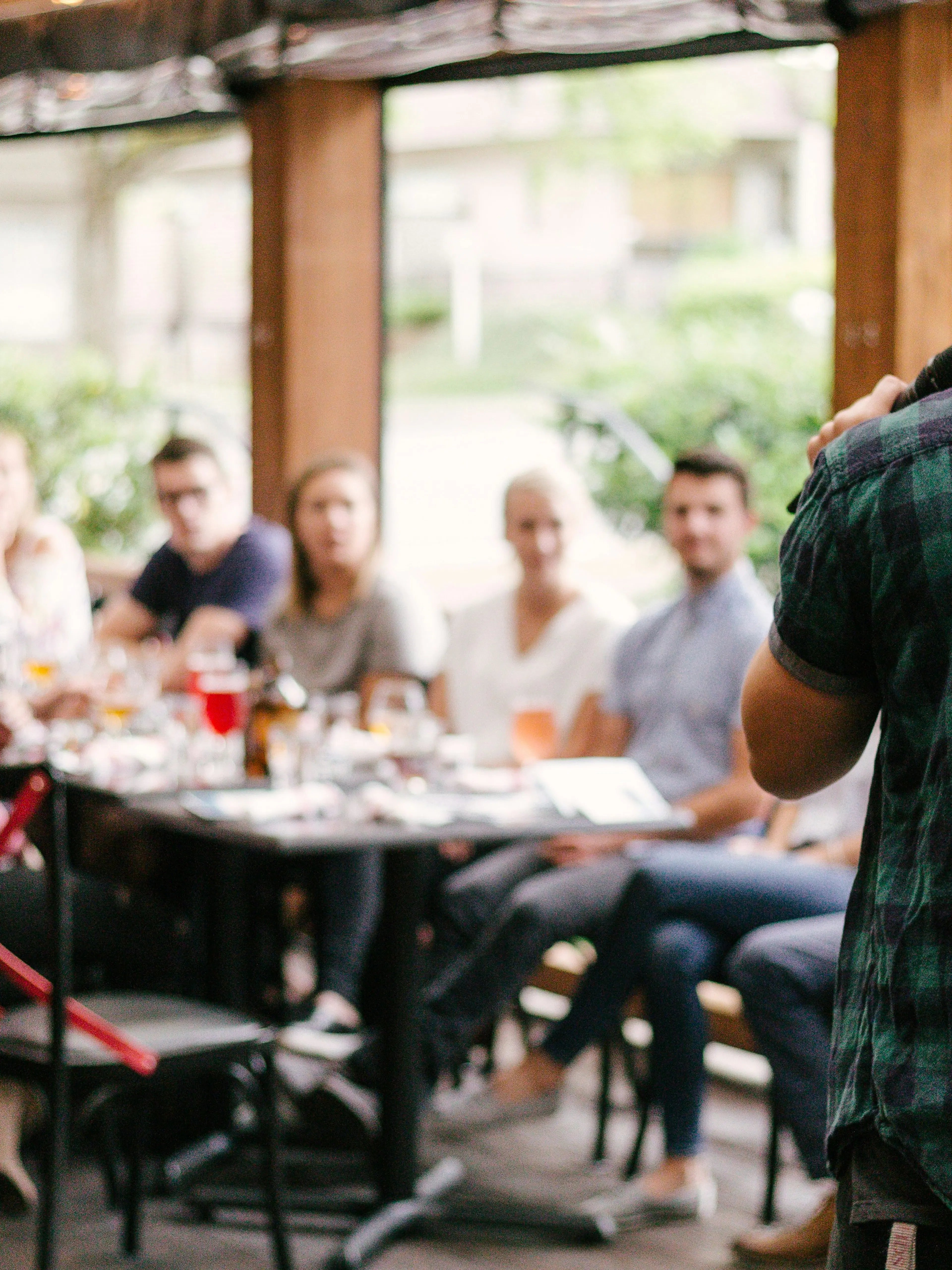 man standing infront of group of people