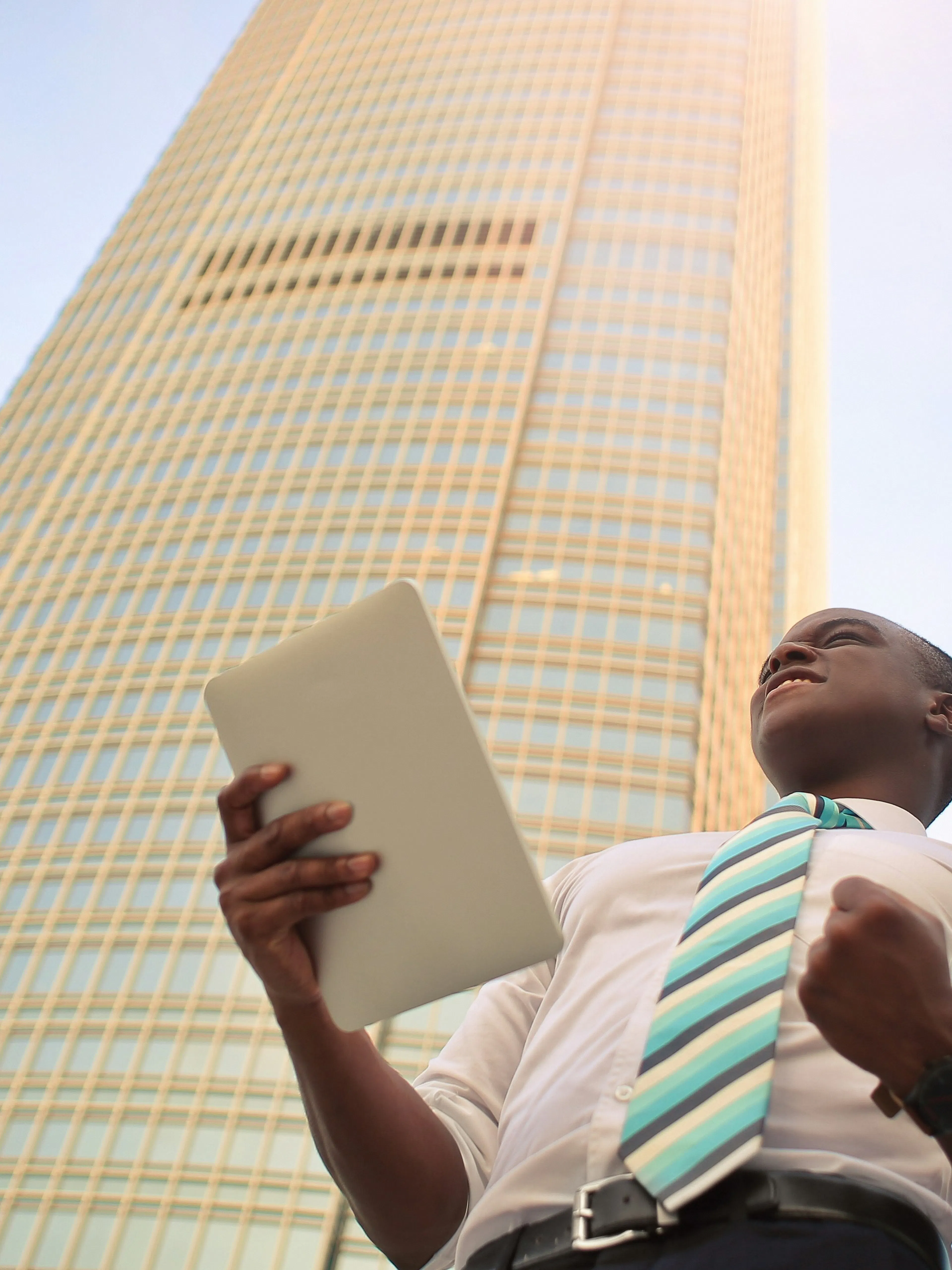 man standing near high-rise building