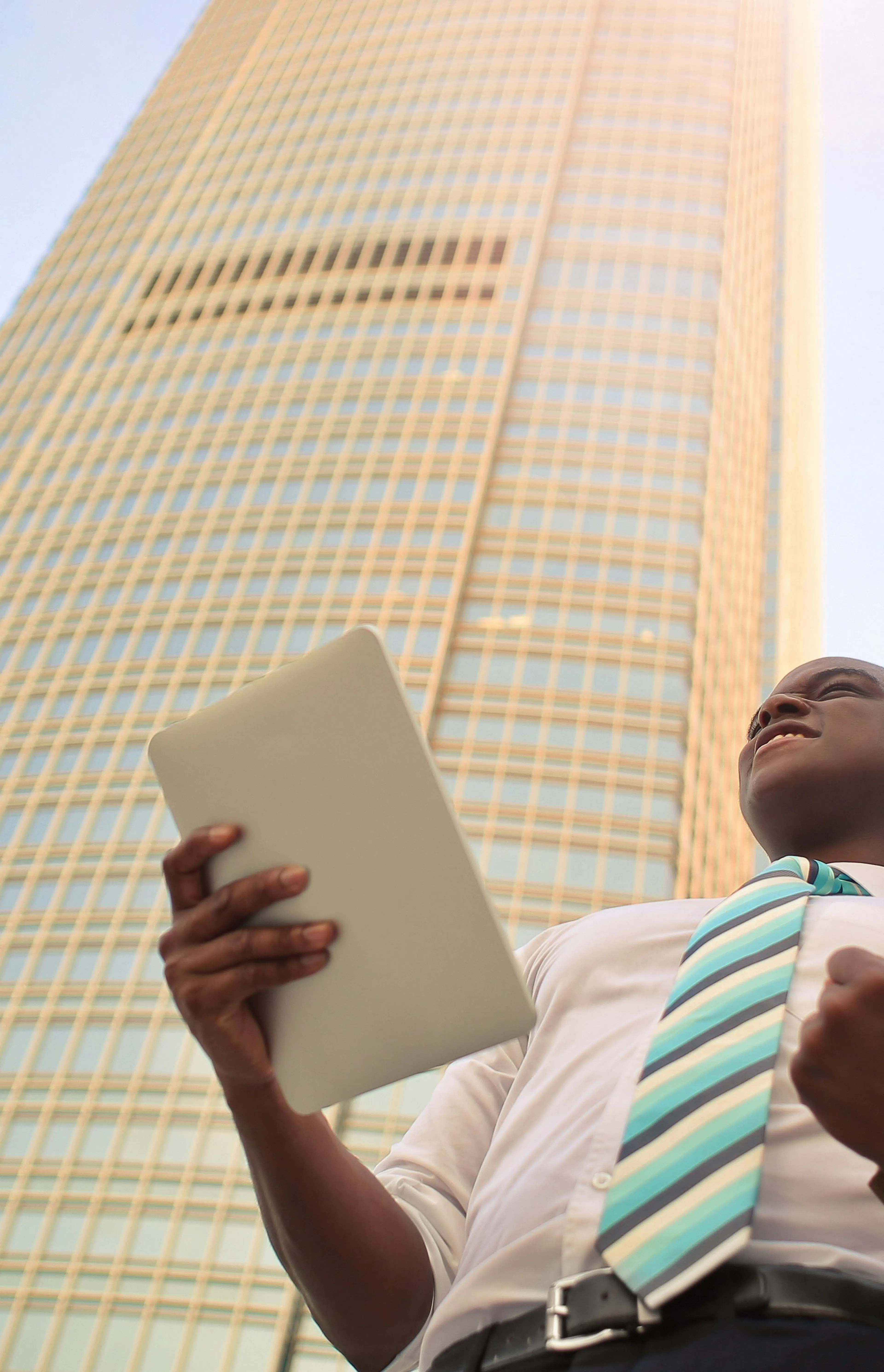 man standing near high-rise building