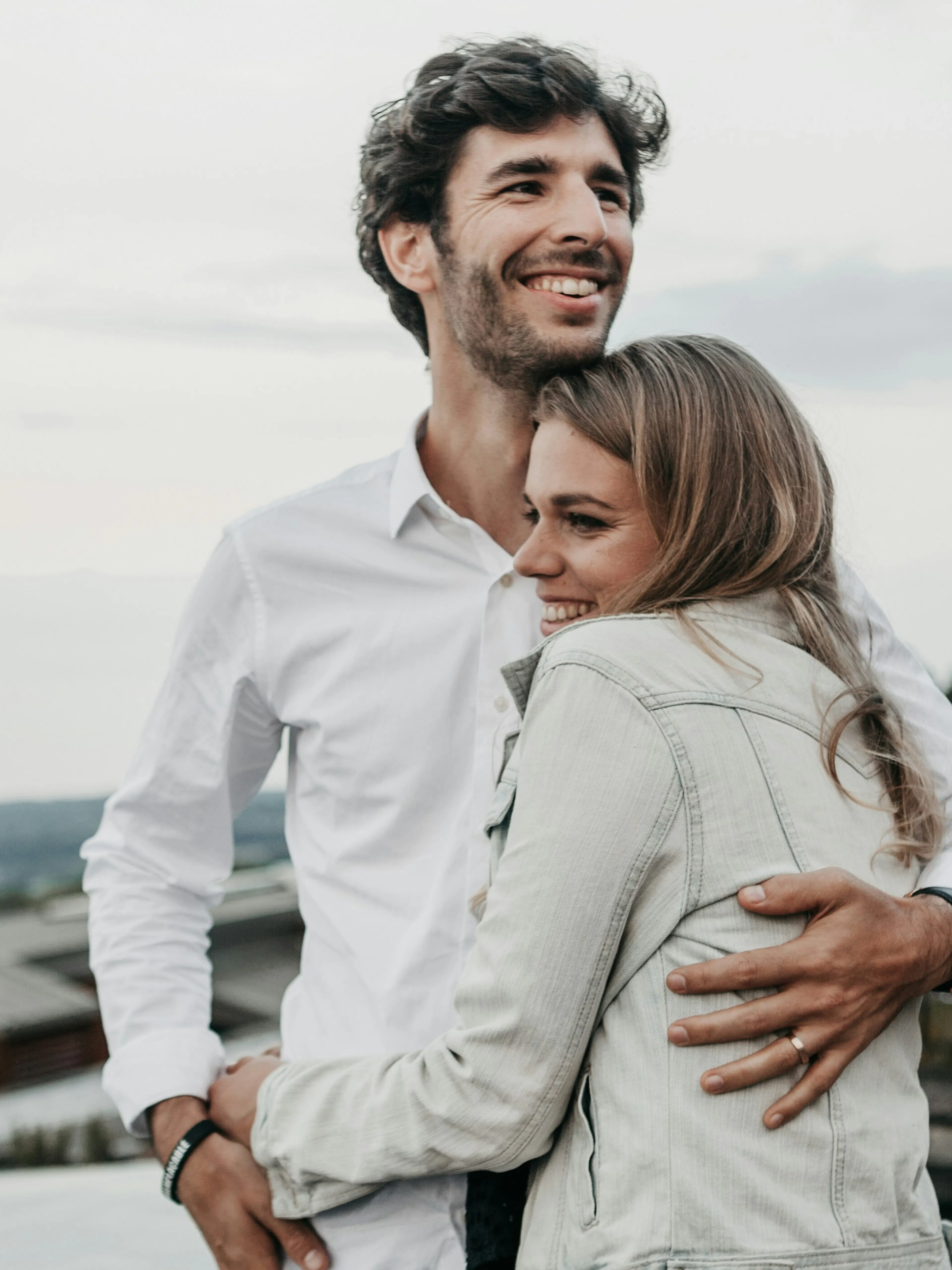 man and woman hugging each other