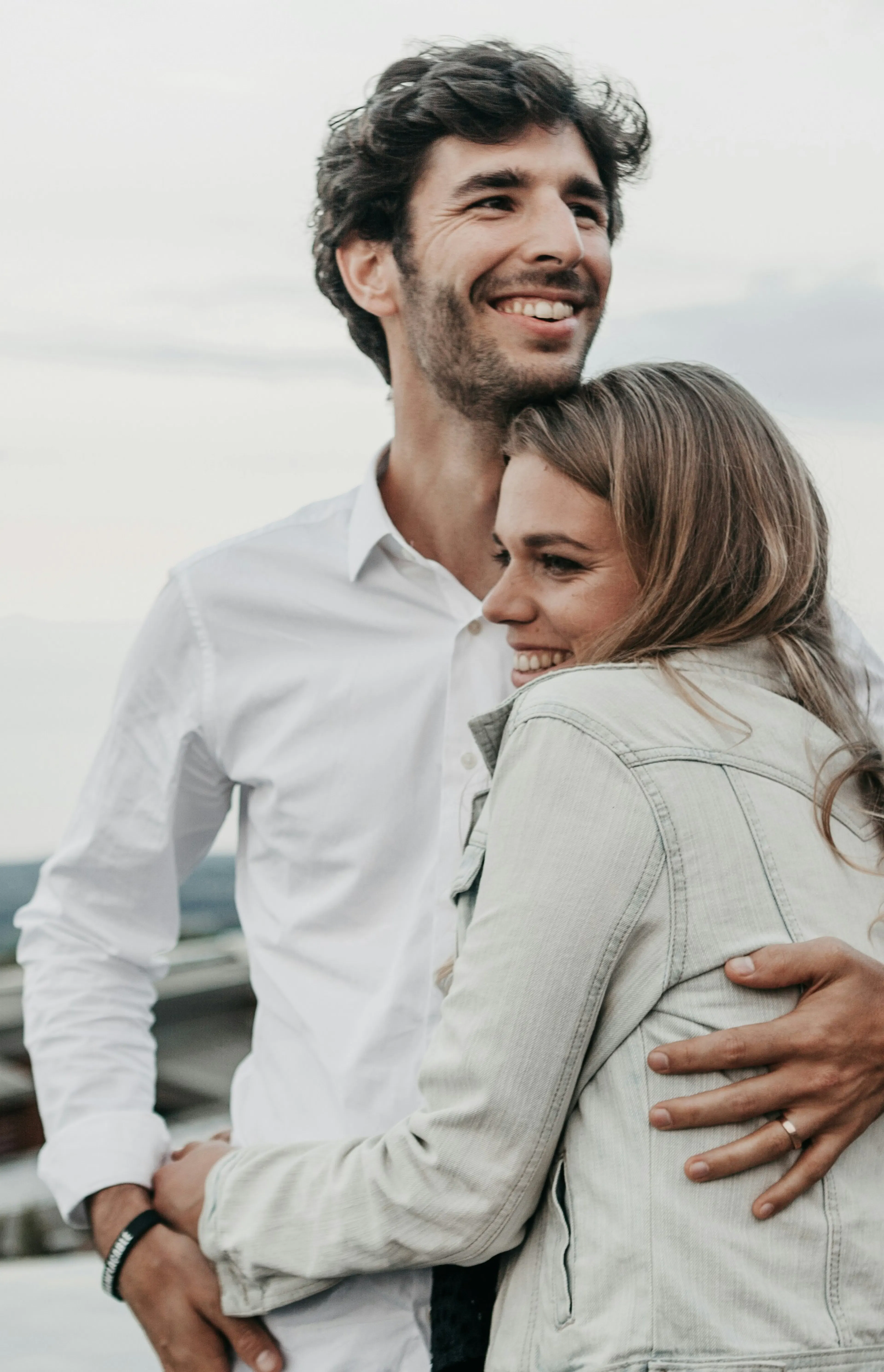 man and woman hugging each other