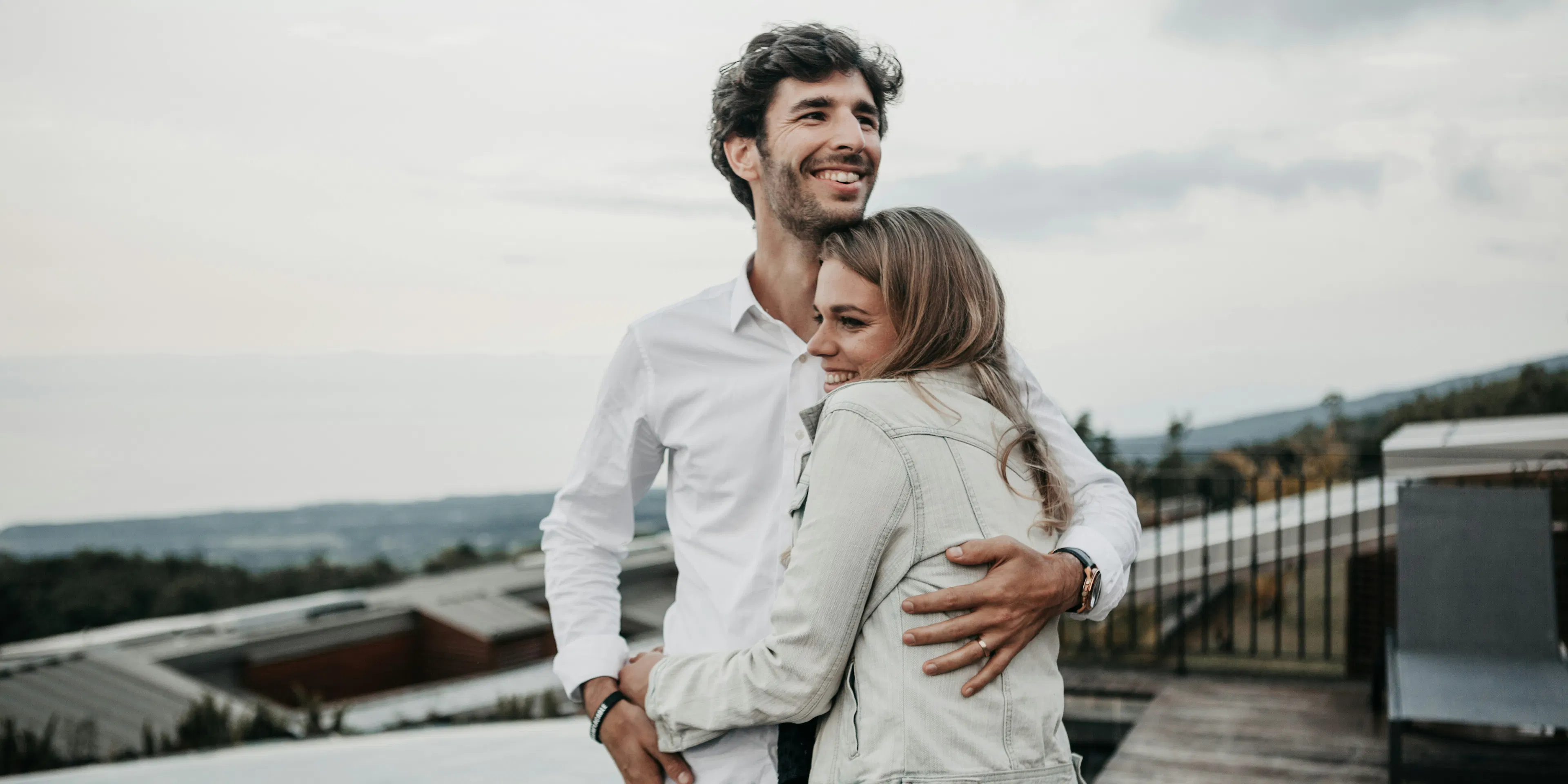 man and woman hugging each other