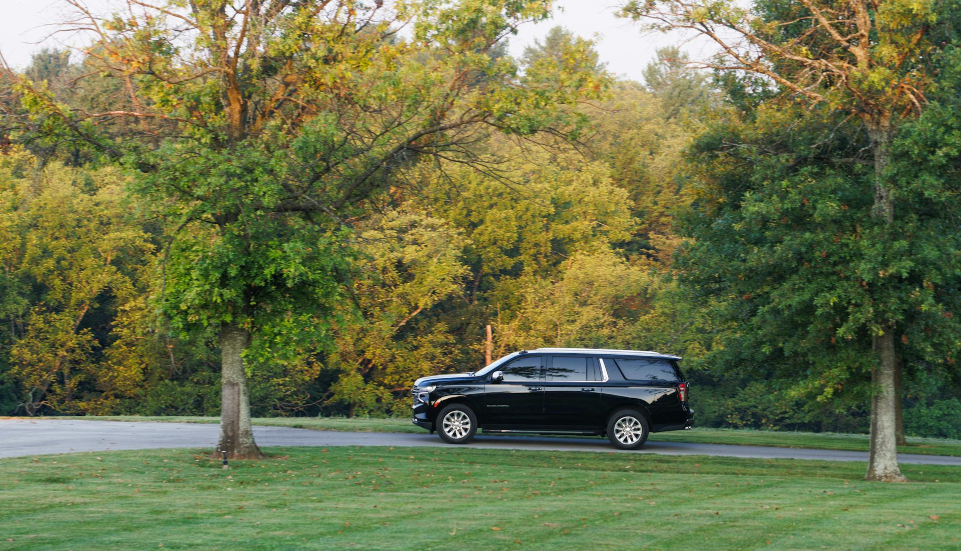 Mint Julep Experiences SUV travels through the tree line of Buffalo Trace Distillery.