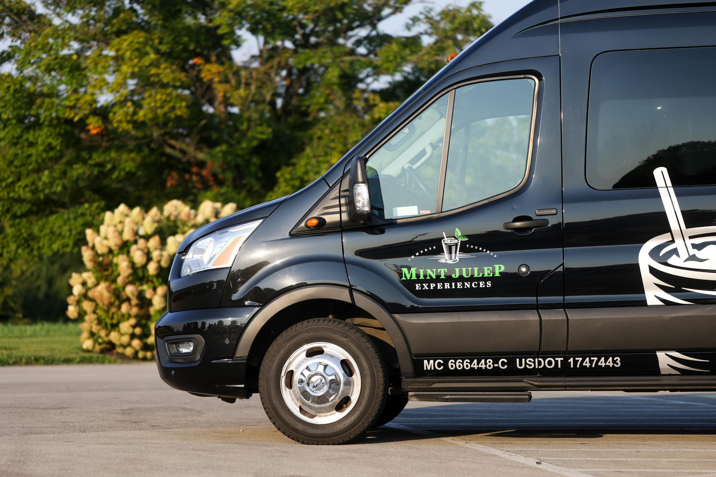 A black luxury vehicle from Mint Julep Experiences.