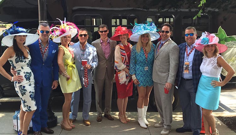 A group of people dressed for Kentucky Derby Week posing for the camera.