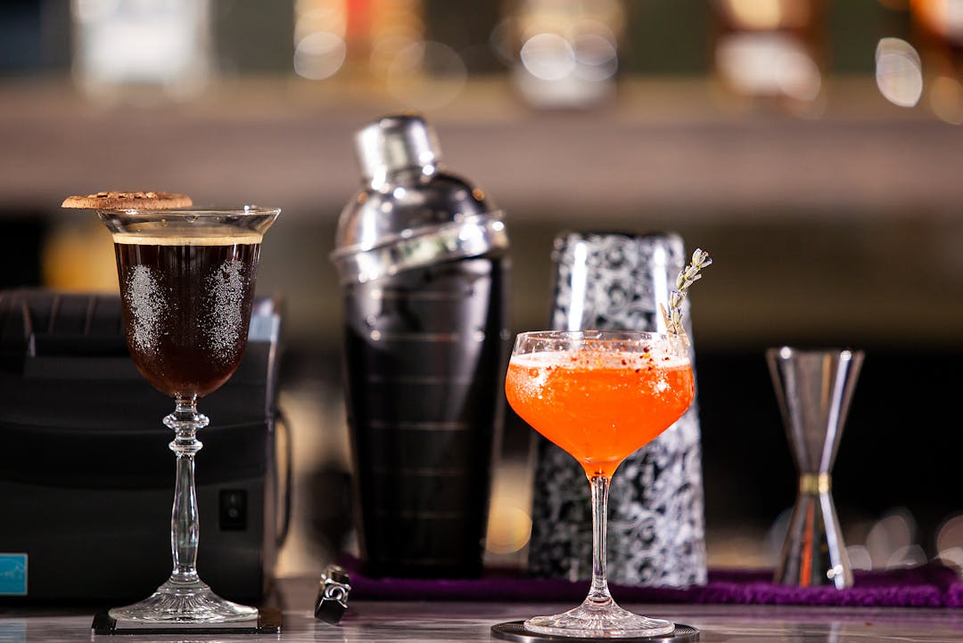 Various drinks are arranged on the counter.
