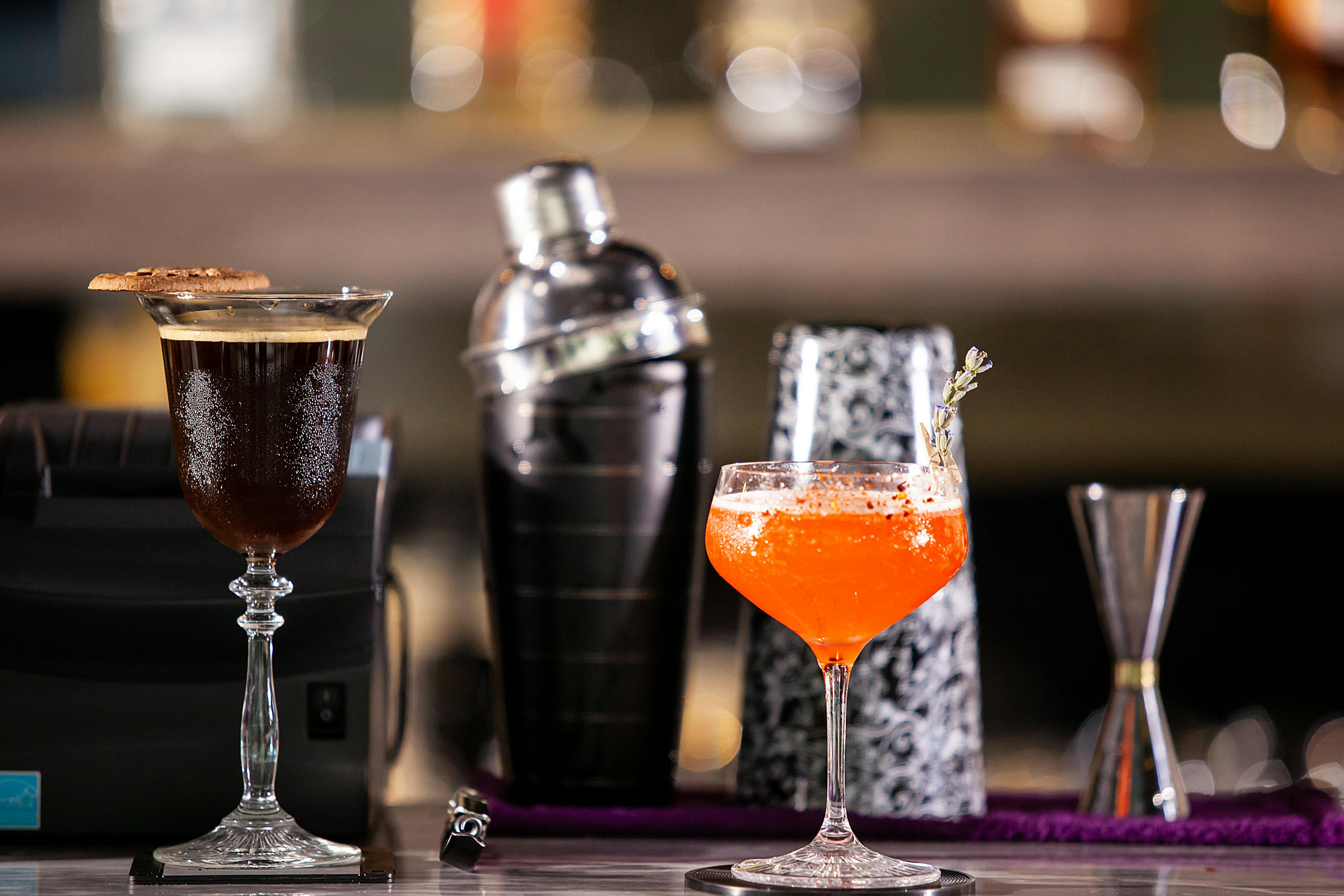 Various drinks are arranged on the counter.