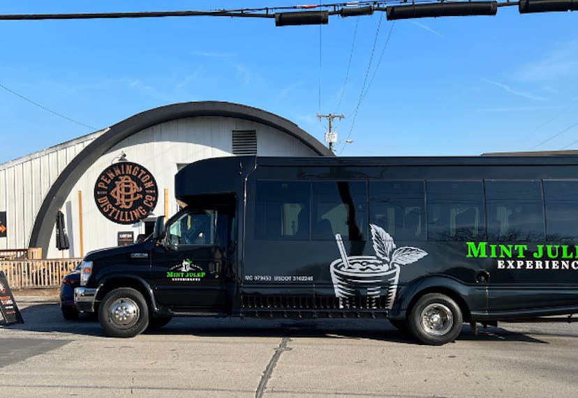 A Mint Julep Experiences tour vehicle parked in front of Pennington Distilling Co. in Nashville, TN.