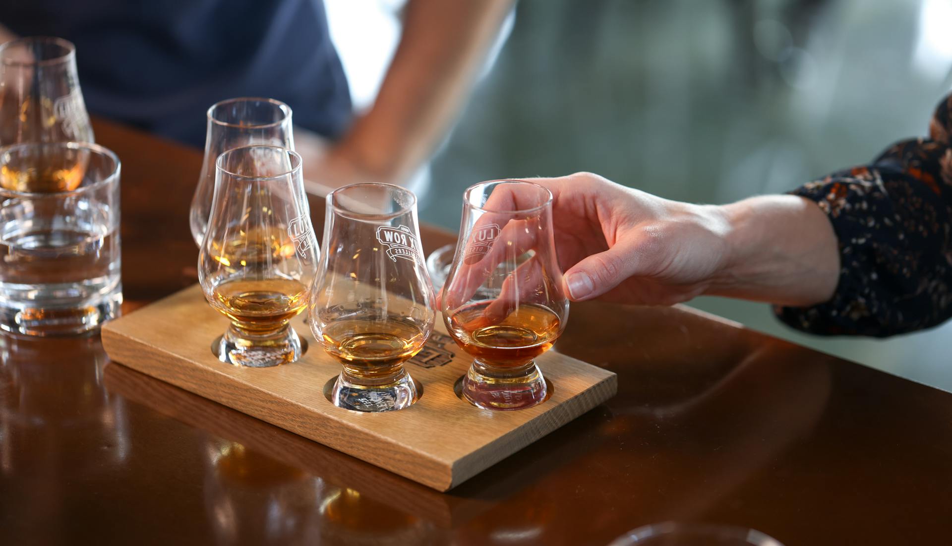 A set of glasses with bourbon samples.