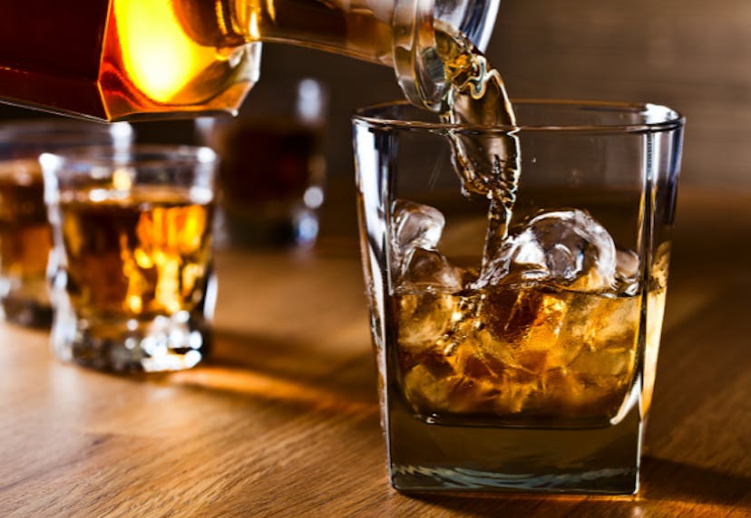 A set of glasses filled with bourbon.