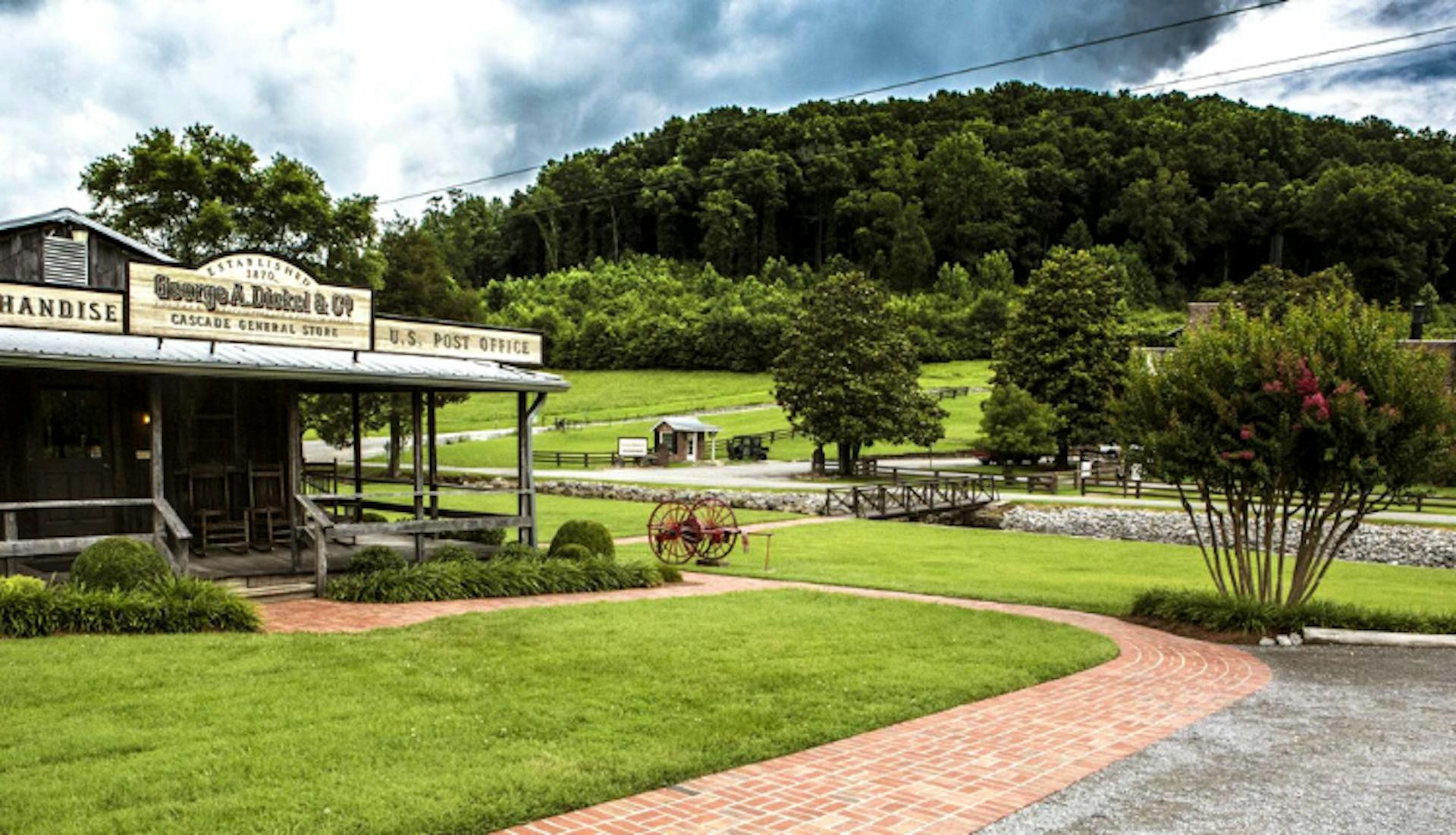 The scenic exterior of George Dickel Distillery, surrounded by natural beauty and rustic charm.