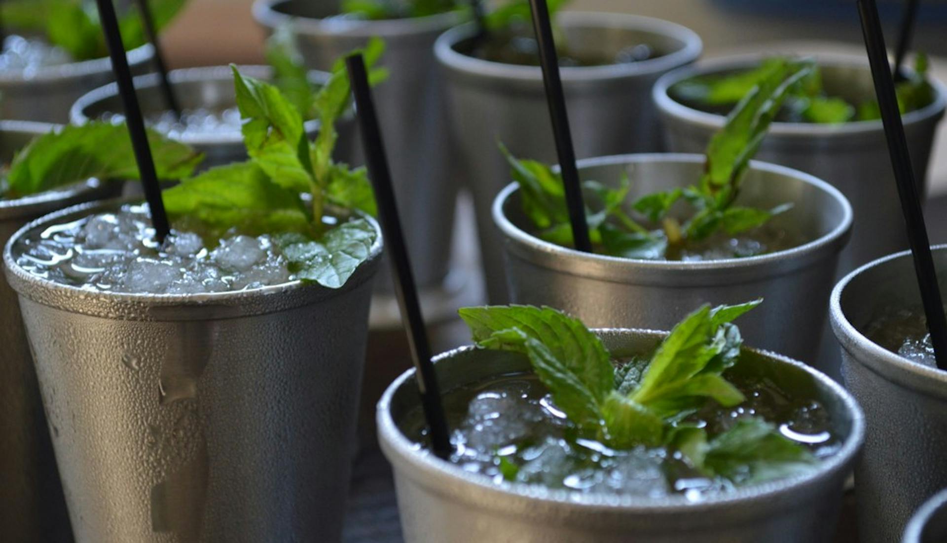 Mint Julep cocktails in silver cups.