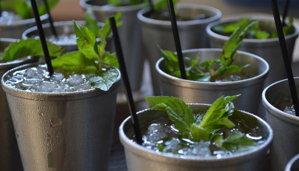 Mint Julep cocktails in silver cups.