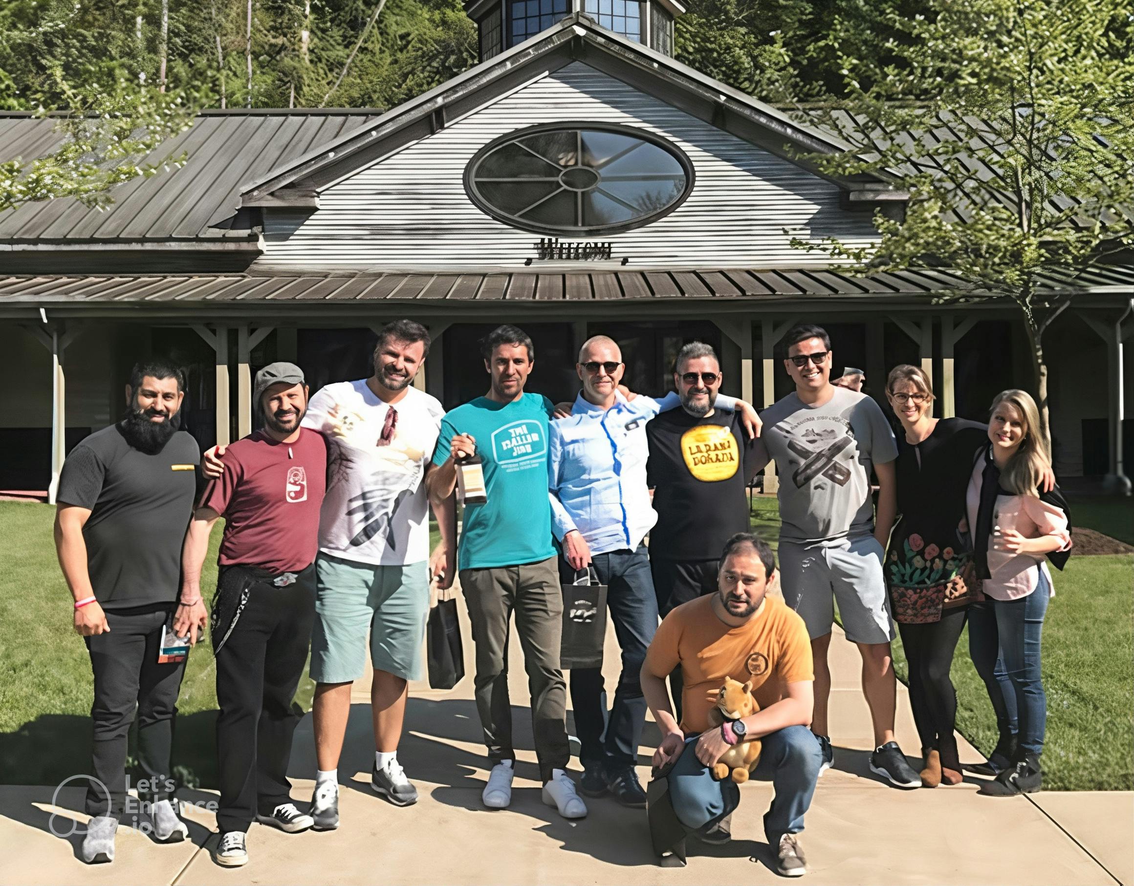 A group of tourists posing in front of Jack Daniel's Distillery.