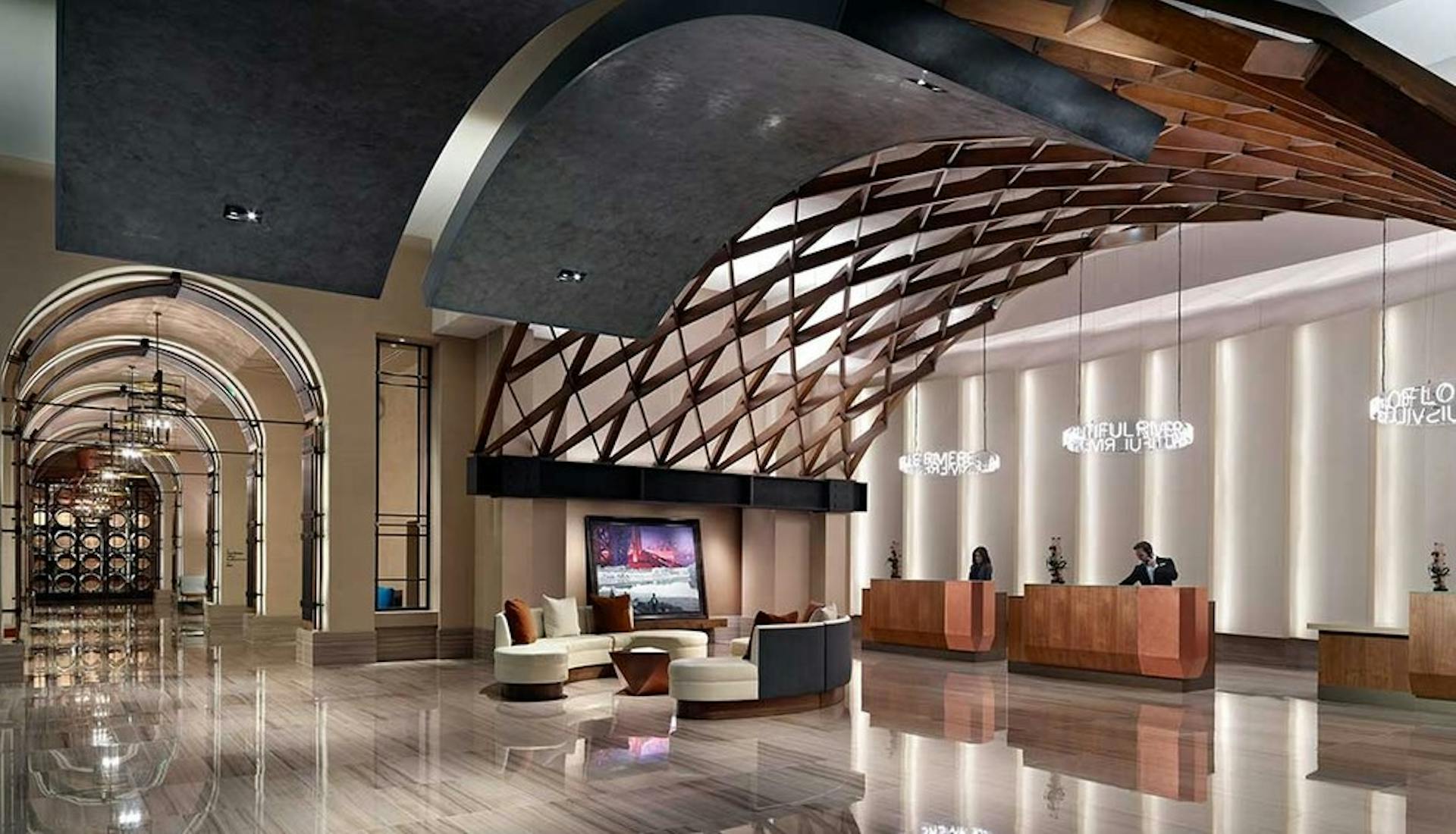 Elegant reception area of the Omni Louisville Hotel featuring a modern front desk and inviting lighting.