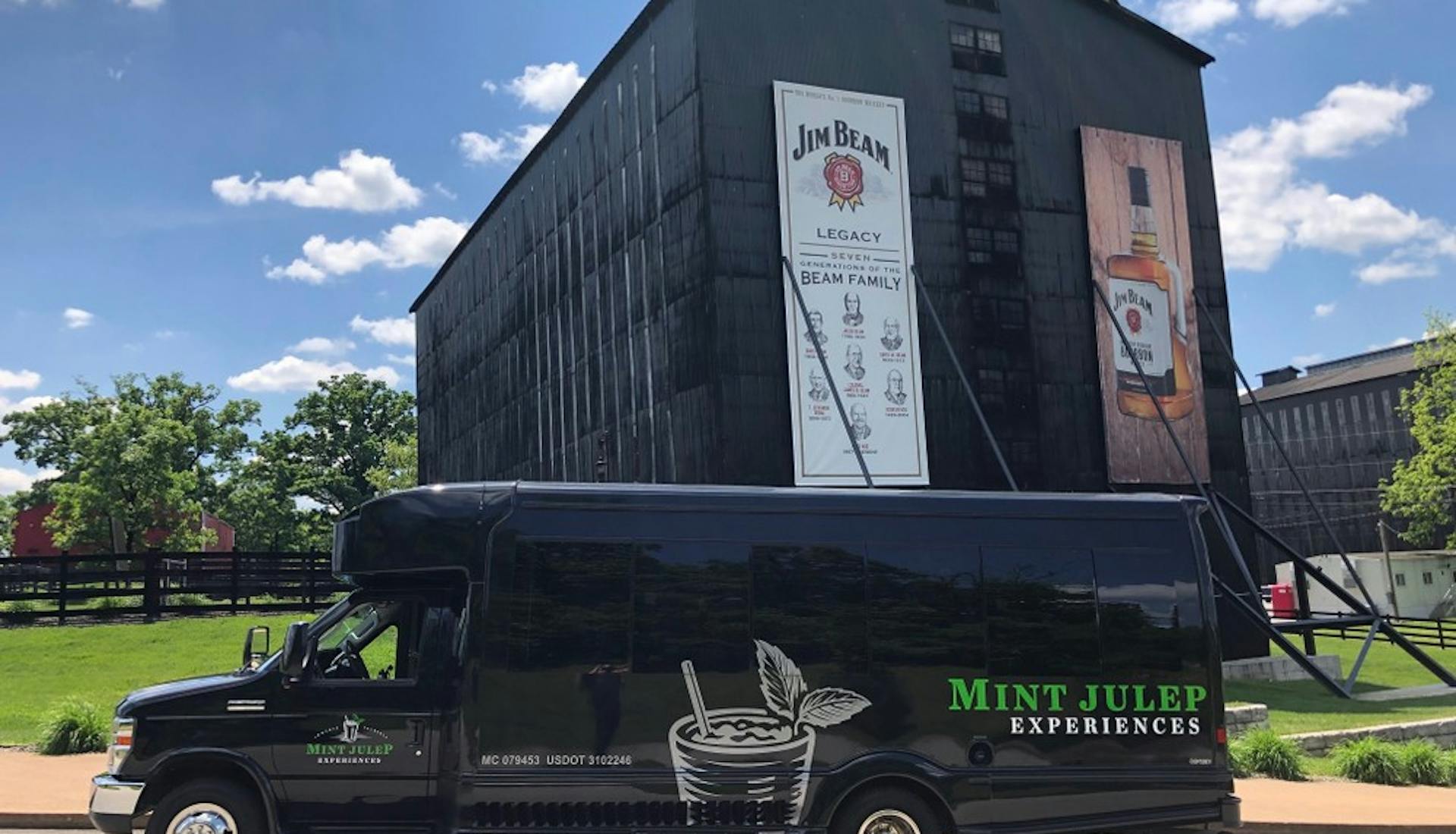 A Mint Julep Experiences luxury transportation parked in front of Jim Beam Distillery 