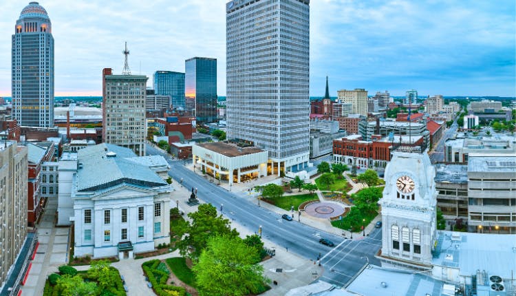 A view of downtown Louisville showcasing its iconic skyline and notable buildings.