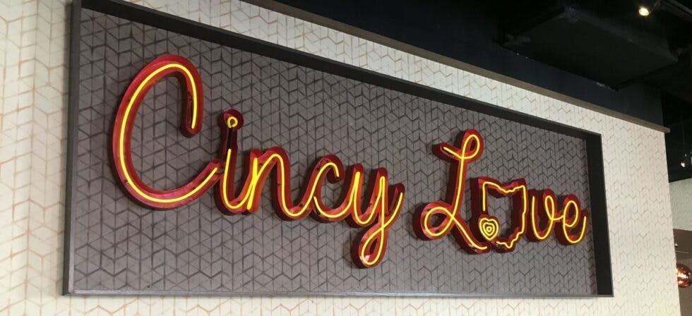 A sign that reads "Cincy Love," glowing brightly.