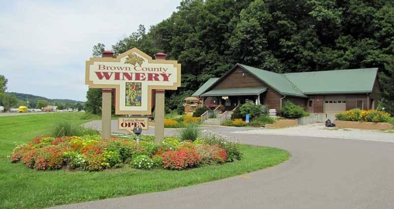The exterior of Brown County Winery, showcasing its rustic charm with a welcoming facade set against a backdrop of lush greenery.The exterior of Brown County Winery, showcasing its rustic charm with a welcoming facade set against a backdrop of lush greenery.