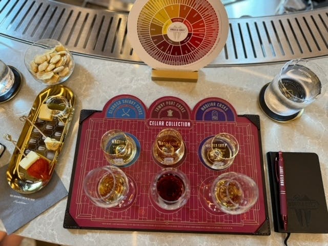 A bourbon tasting flight with multiple glasses of whiskey arranged, ready for sampling.