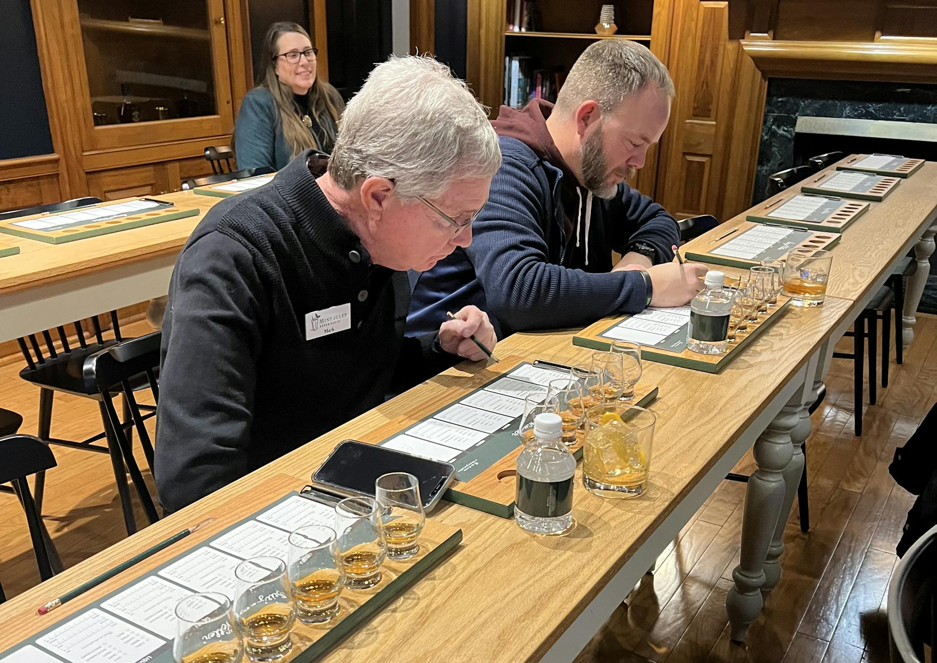 a group of people enjoying a tasting at stitzel weller with mint julep experiences