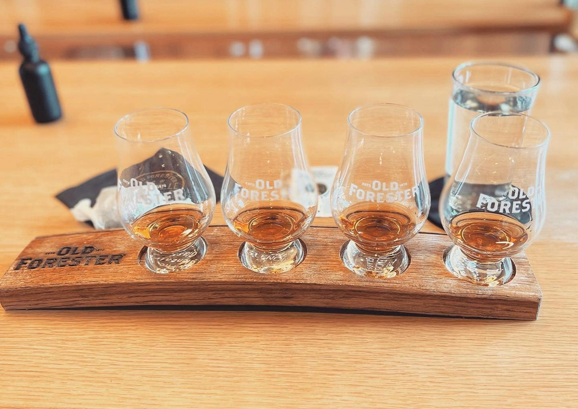 a tasting flight served at the end of an old forester distillery tour