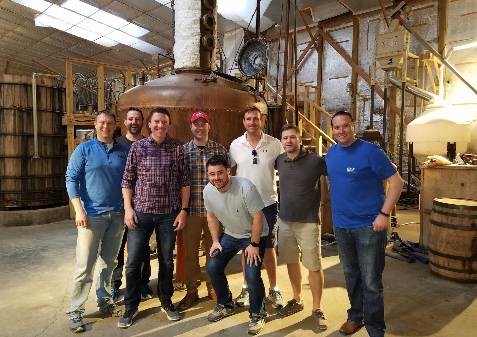 a mint julep experiences tour group enjoying a tour at kentucky artisan distillery