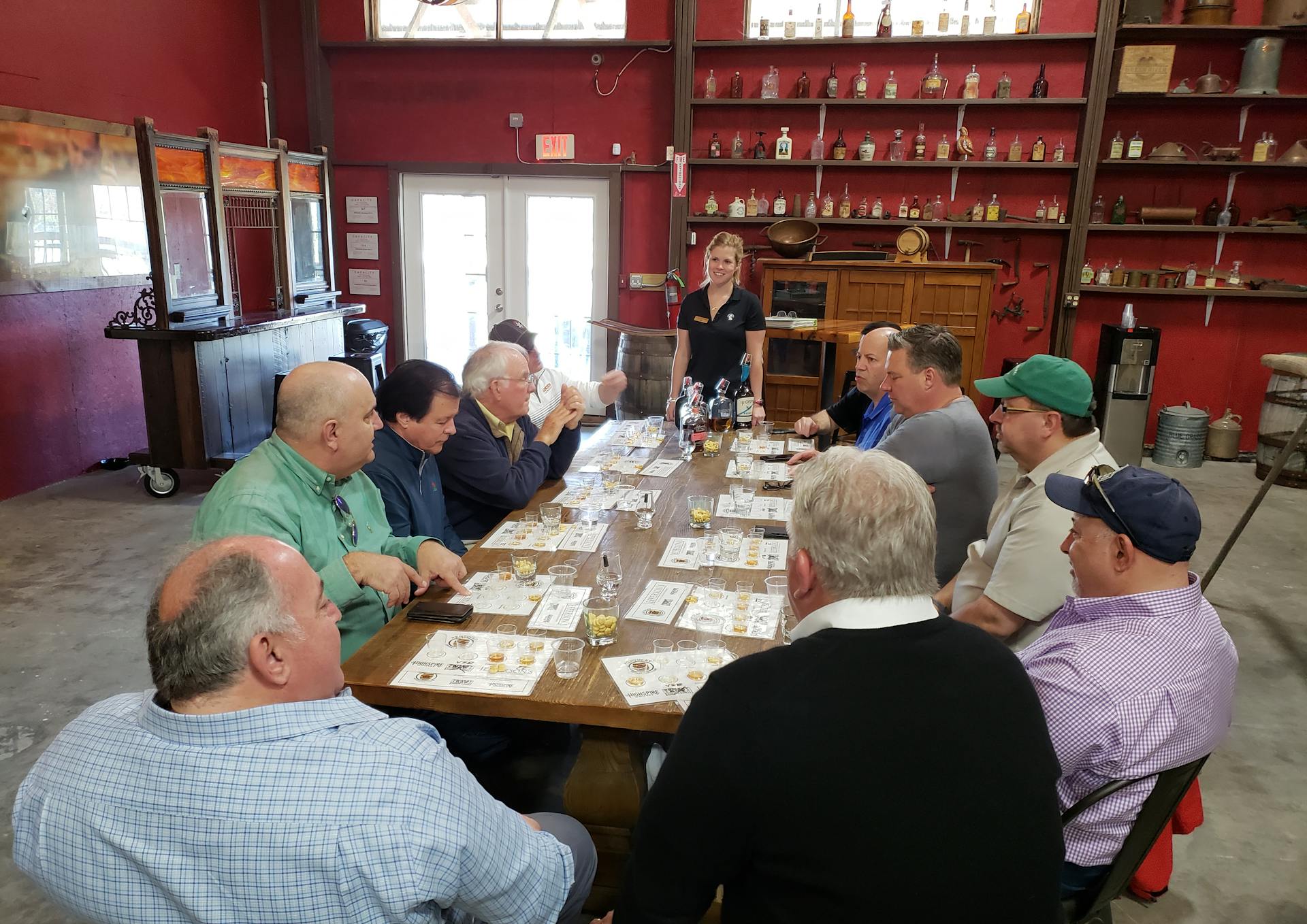 a mint julep experiences tour group enjoying a guided tasting at kentucky artisan distillery