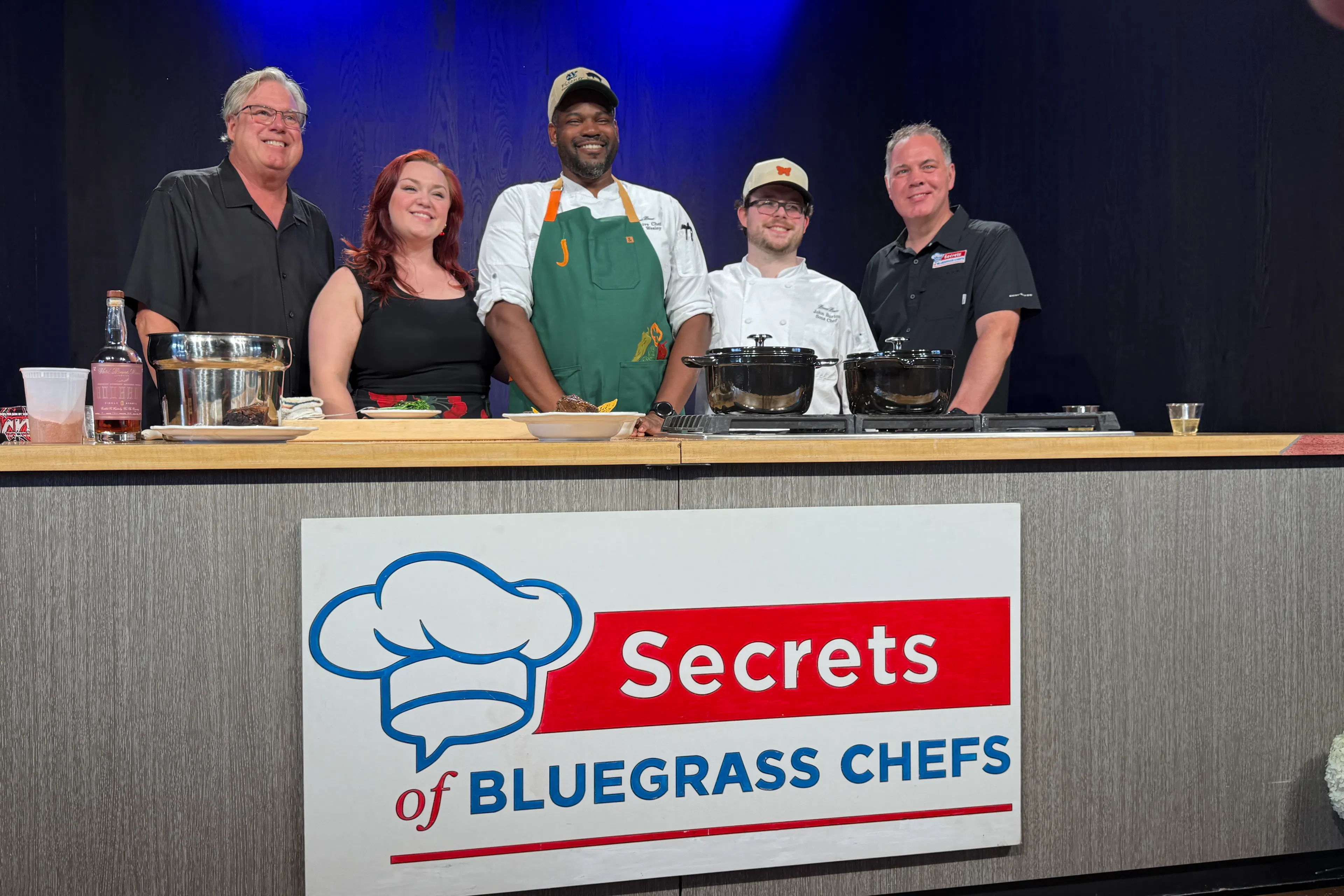 Chefs prepare a meal at the secrets of bluegrass chefs mint julep experiences exclusive