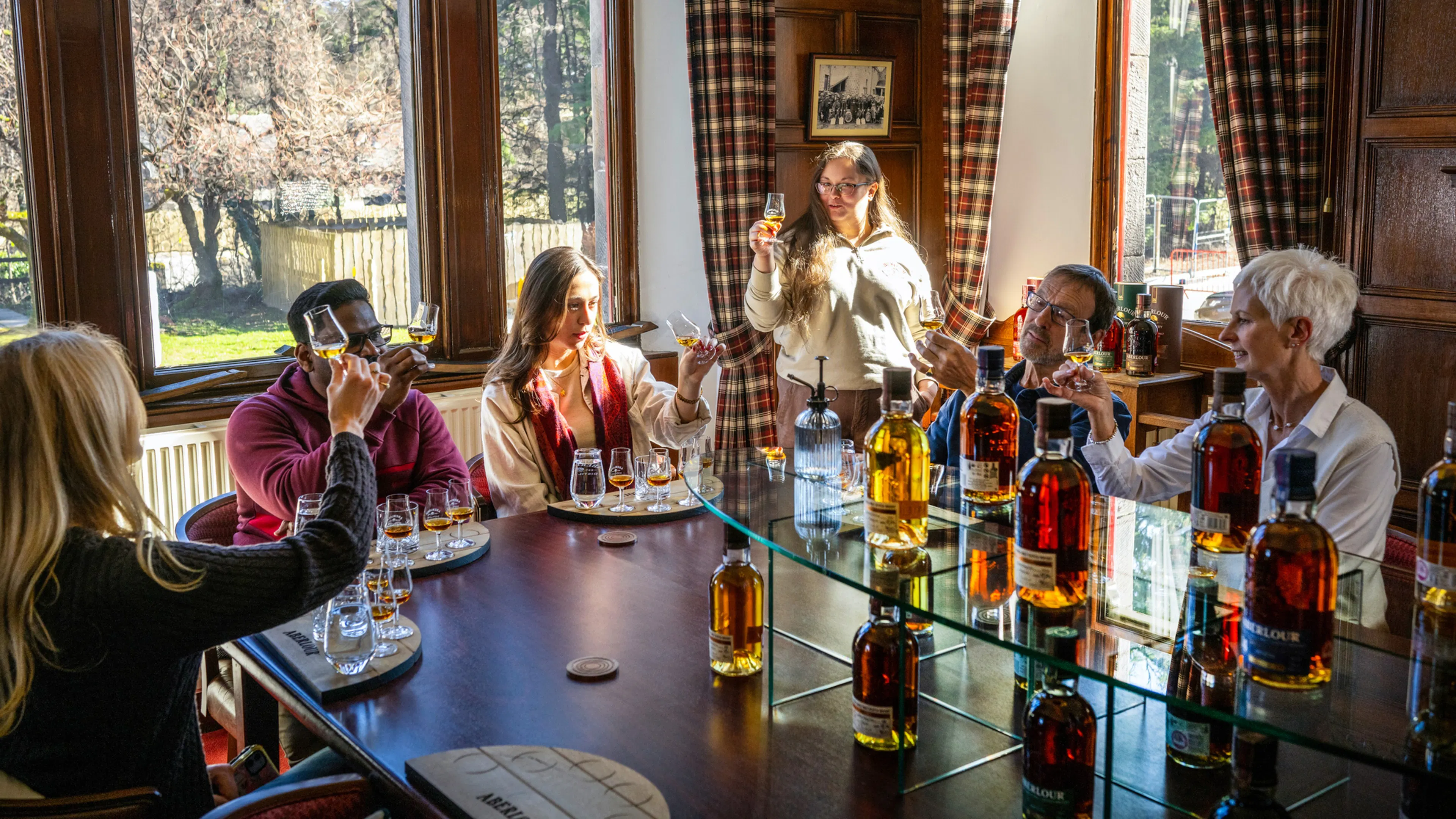 A Scottish Whisky Odyssey tour group enjoying a private, guided tasting at Aberlour