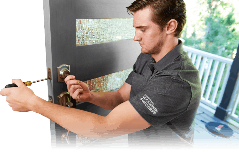 Minute Key locksmith repairing a front door.