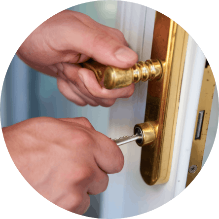 Close-up of a locksmith fixing a door with tools