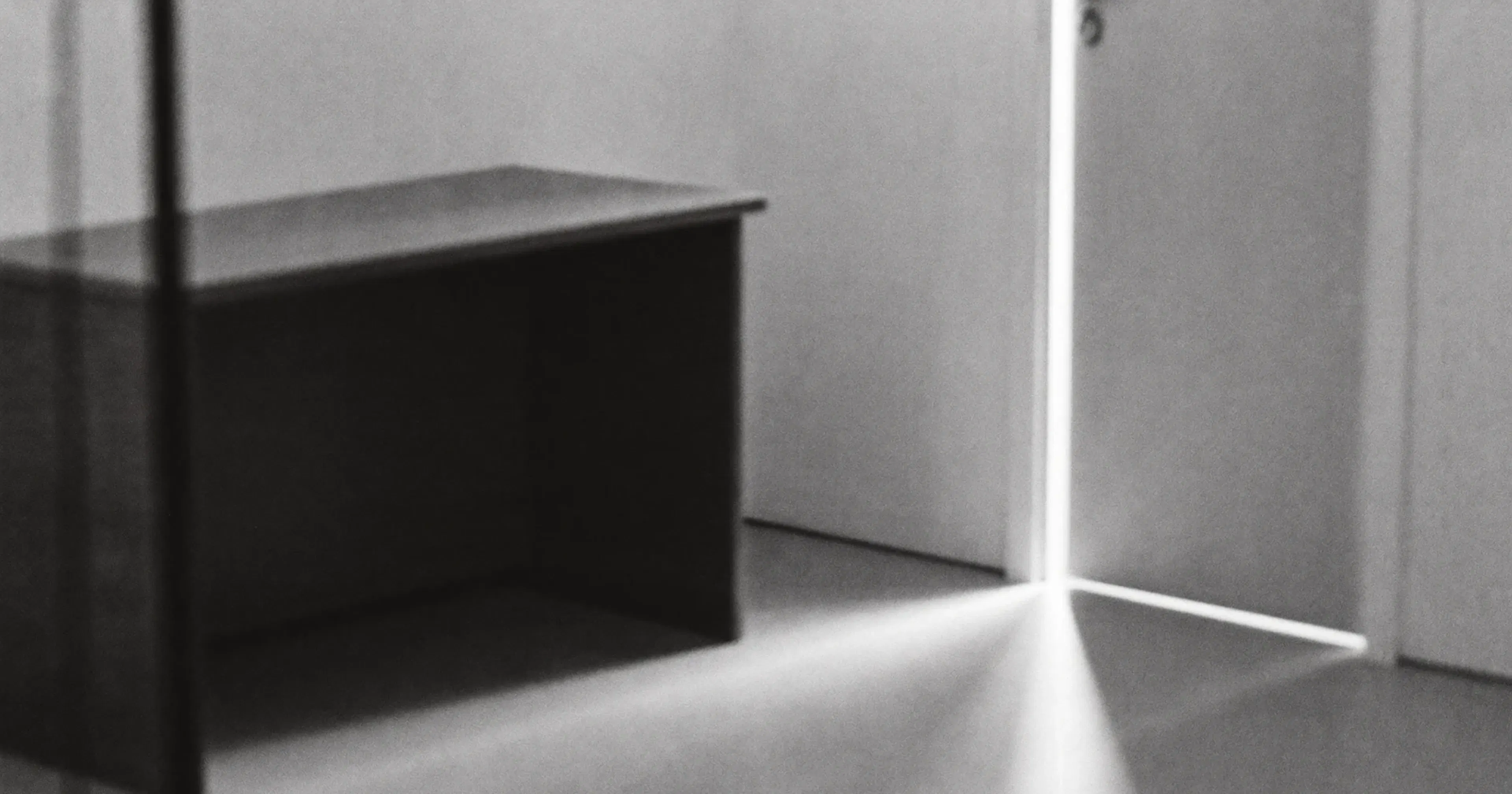 An emptied executive office, preparing a business transition, contemplative black and white