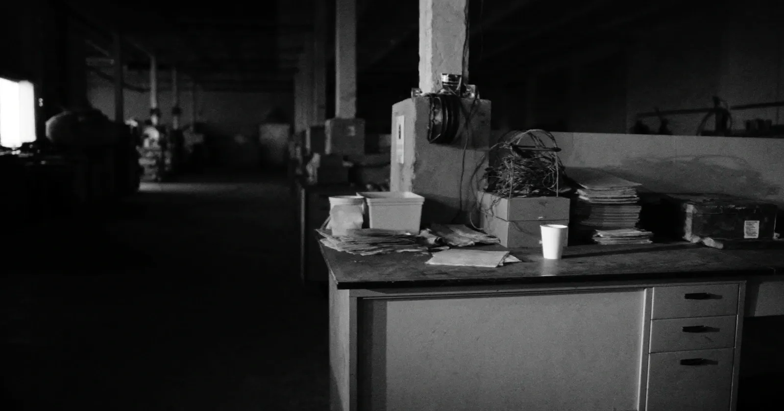 Empty workshop, end of day, contemplative black and white, SME business structure