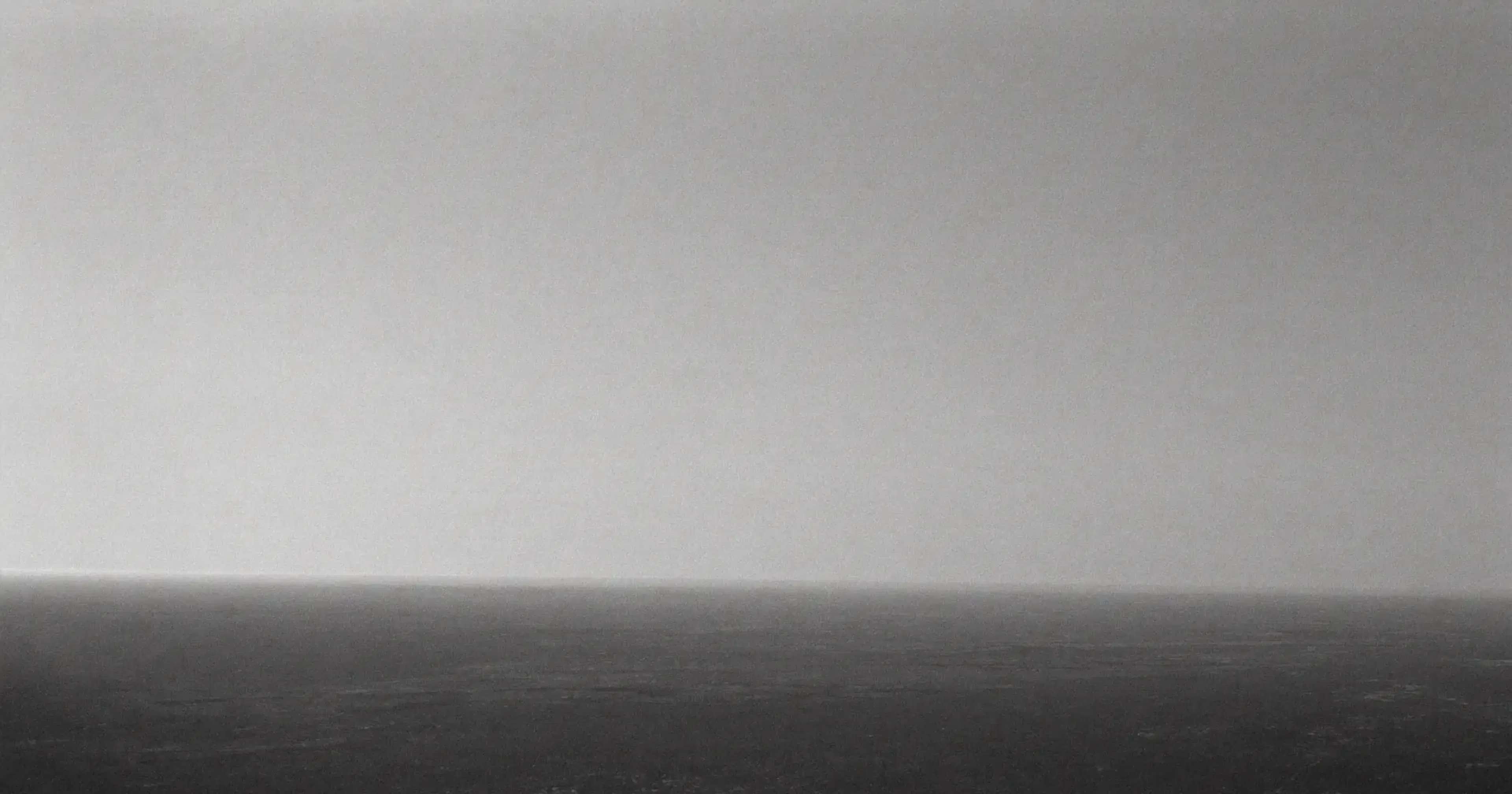 Clear distant horizon seen from a high vantage point, strategic monitoring, anticipation, contemplative black and white