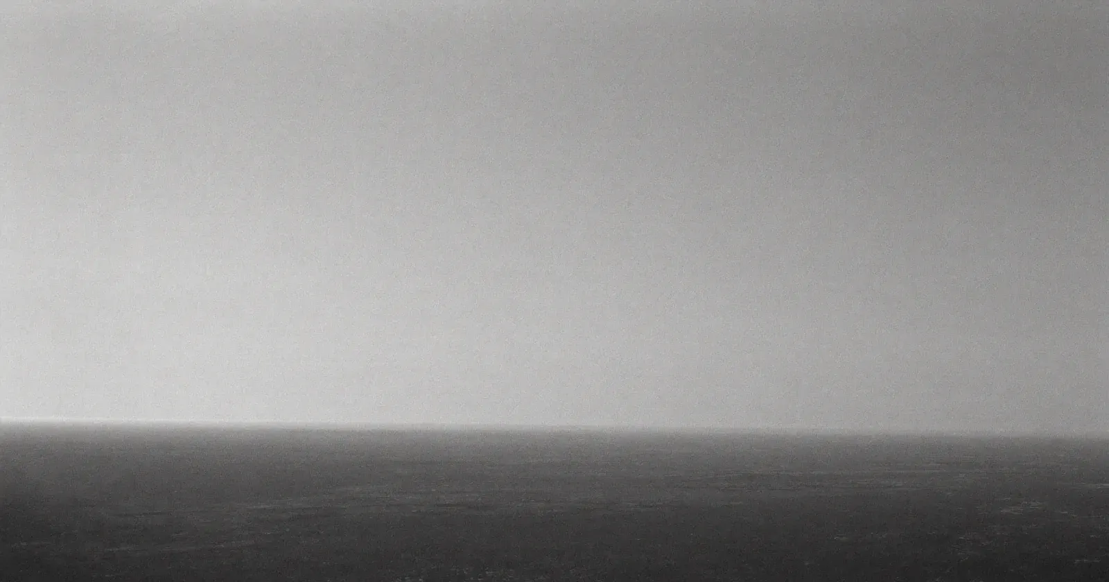 Clear distant horizon seen from a high vantage point, strategic monitoring, anticipation, contemplative black and white