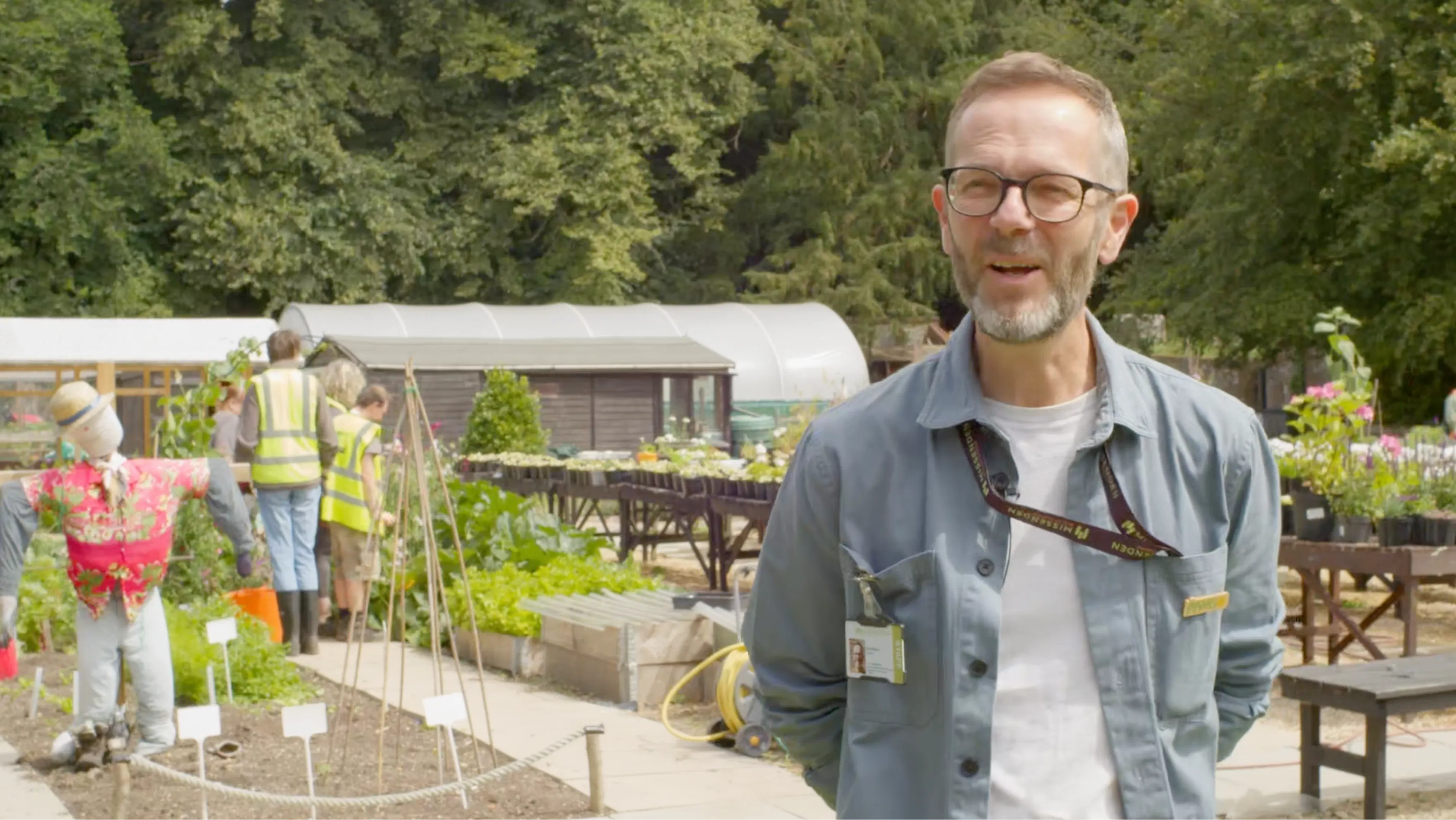 Image of a Director Kyle speaking in a garden