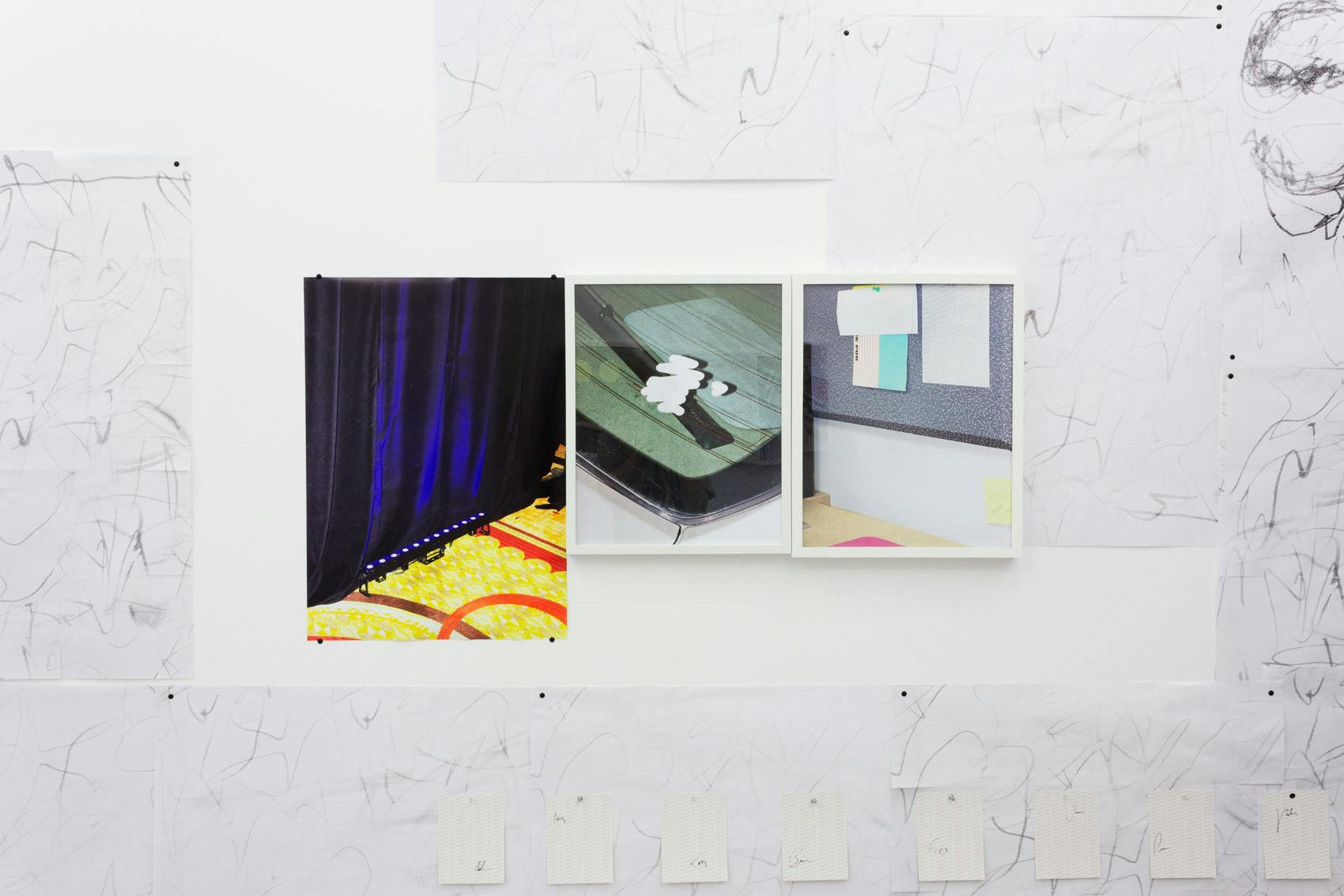 Installation shot of "A Concert" at Arcade On Stadium. Large white room with photographs and posters on the wall.