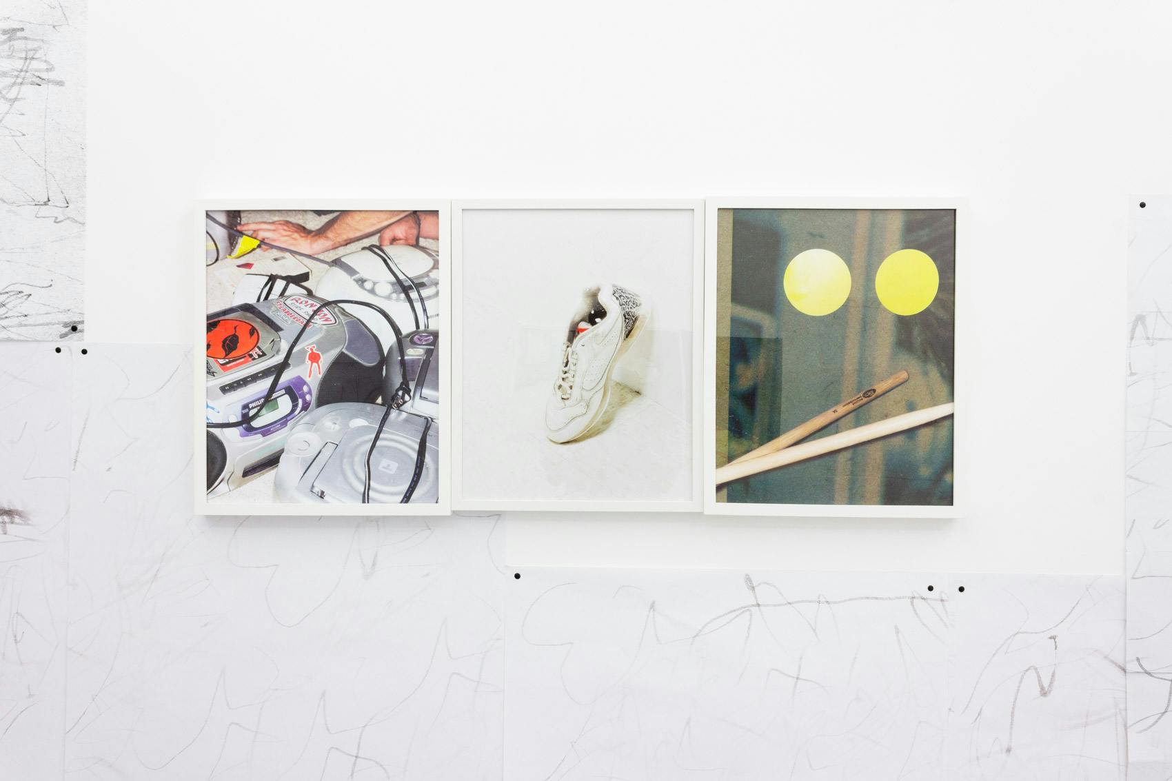 Installation shot of "A Concert" at Arcade On Stadium. Large white room with photographs and posters on the wall.