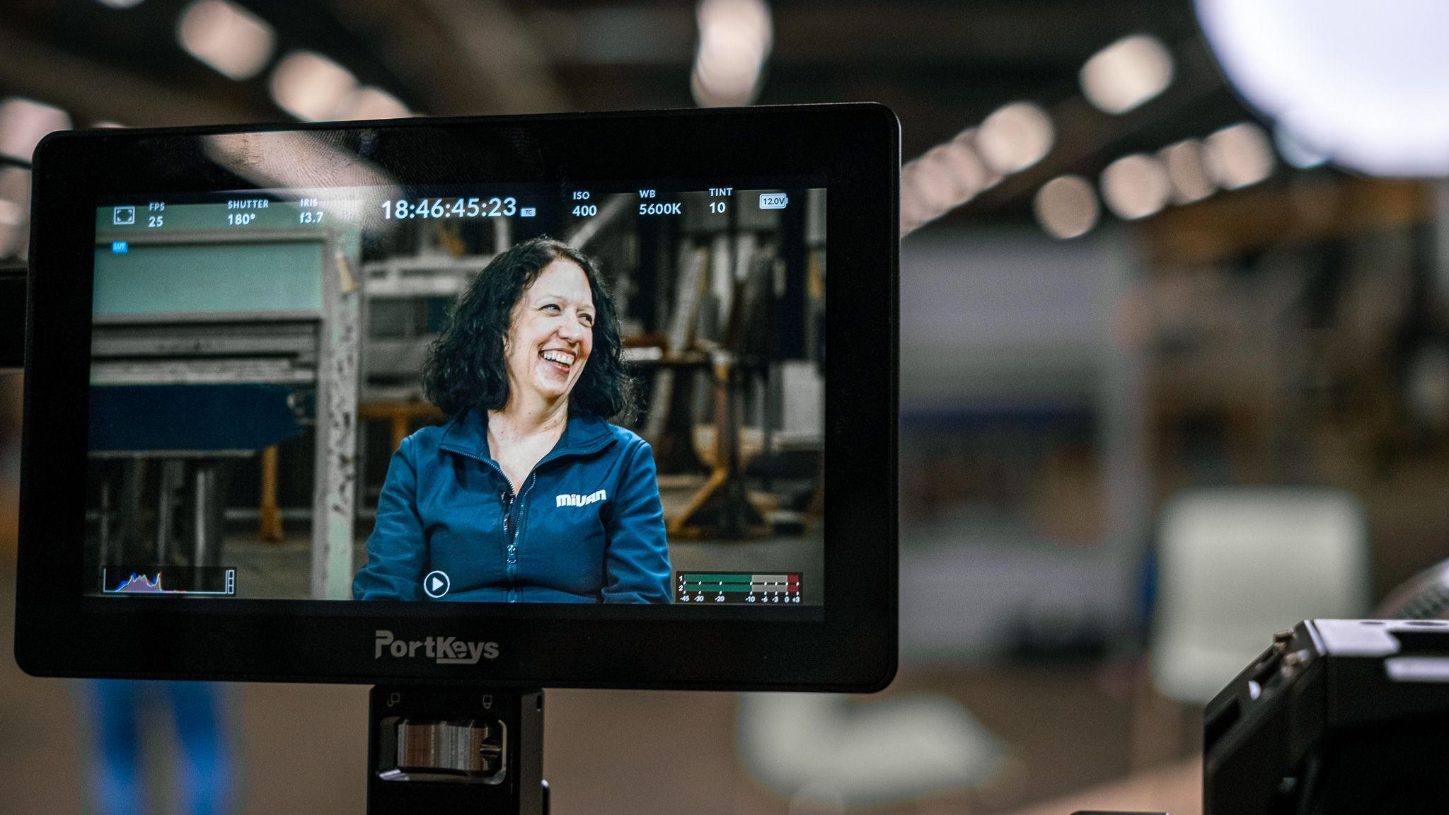Helen laughing on screen.