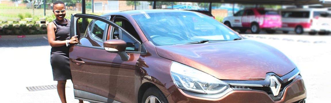 Woman standing next to her car