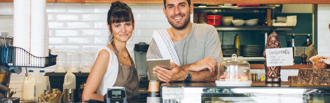 Two people working in the kitchen of the restaurant