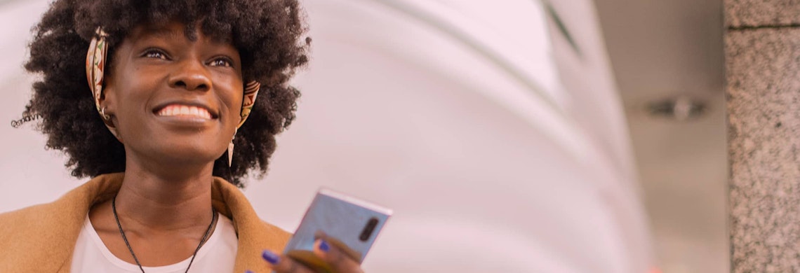 Black woman on a call with earphones on