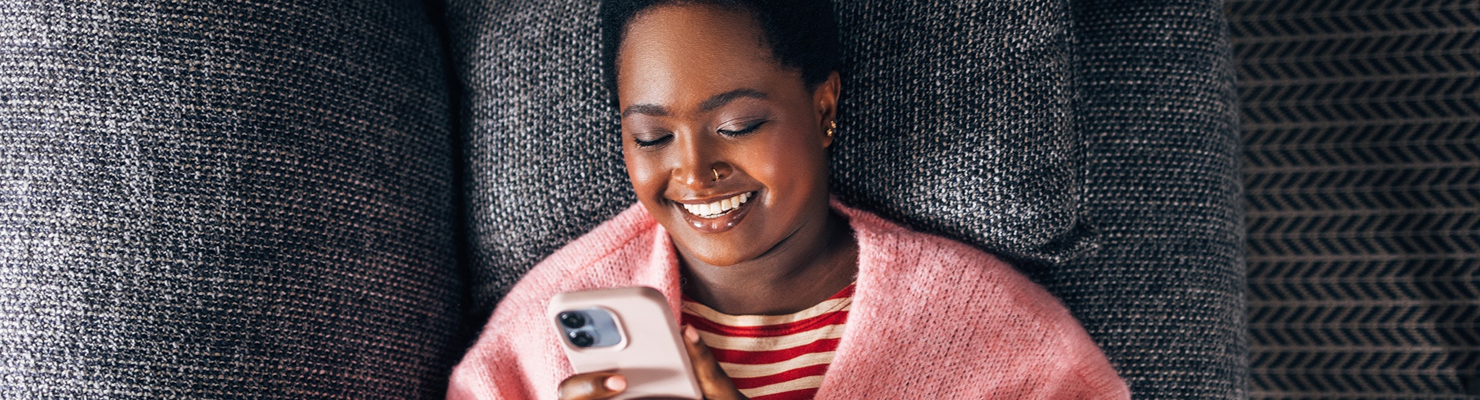 Lady smiling looking at phone